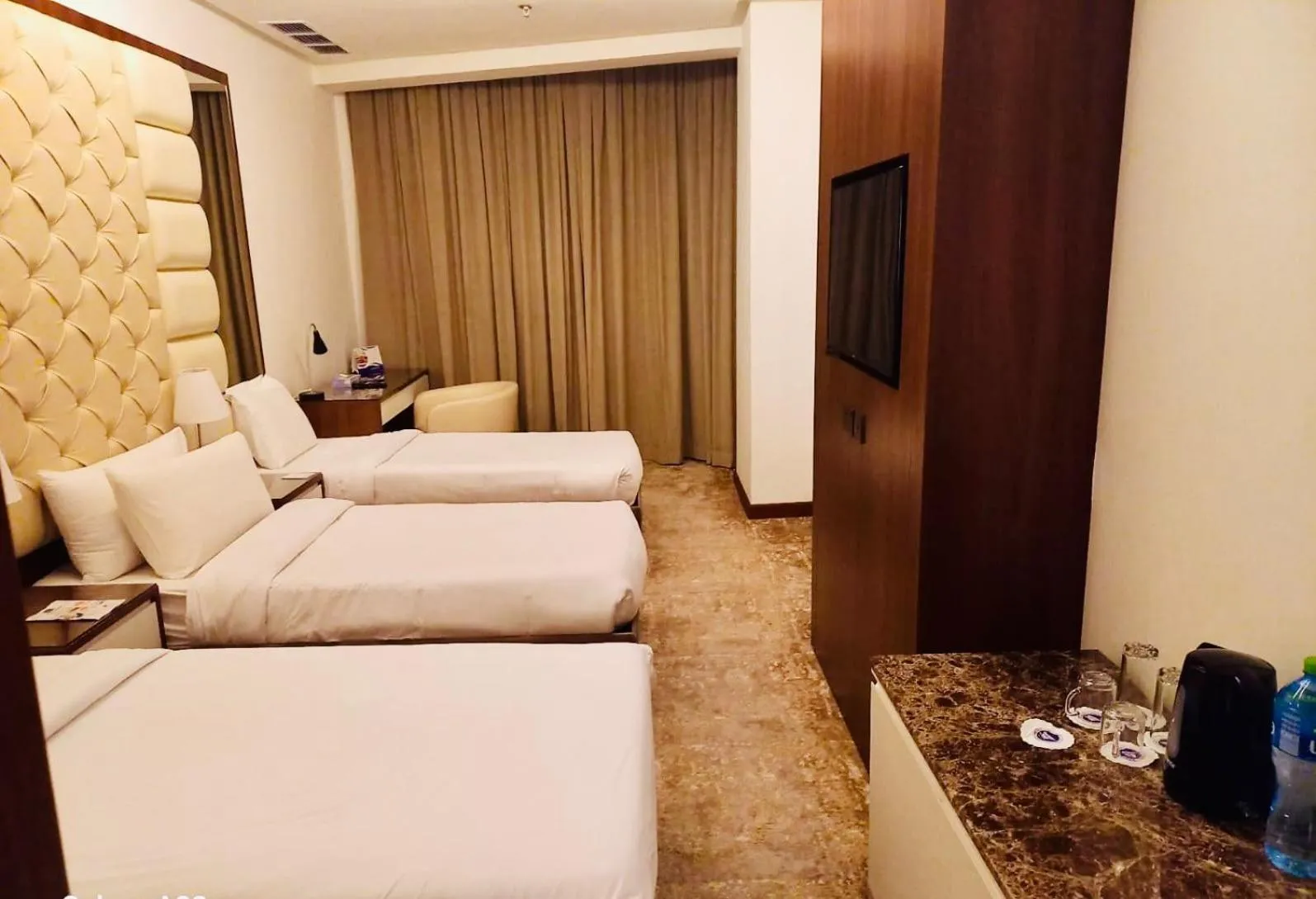 Bed in Dolphin Continental Hotel