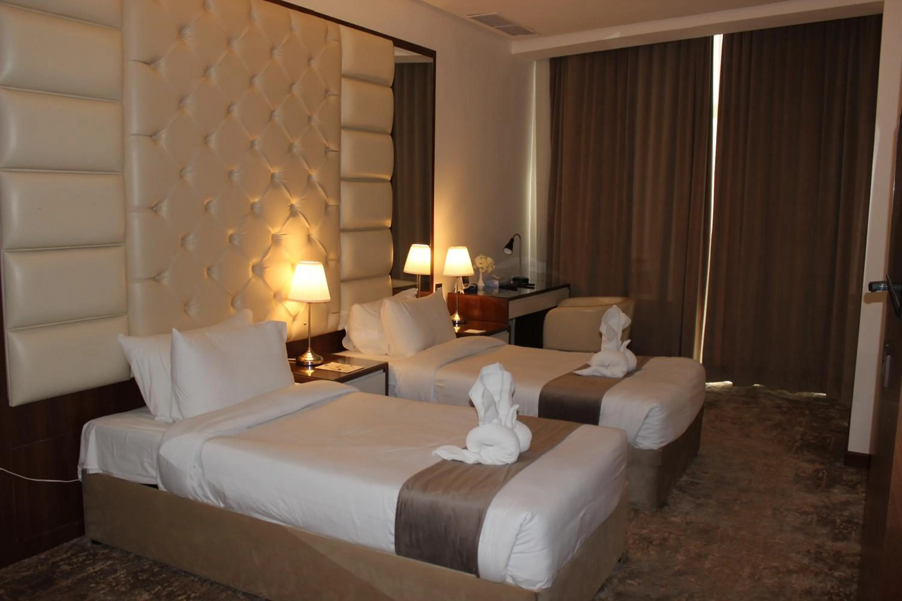 Bed in Dolphin Continental Hotel