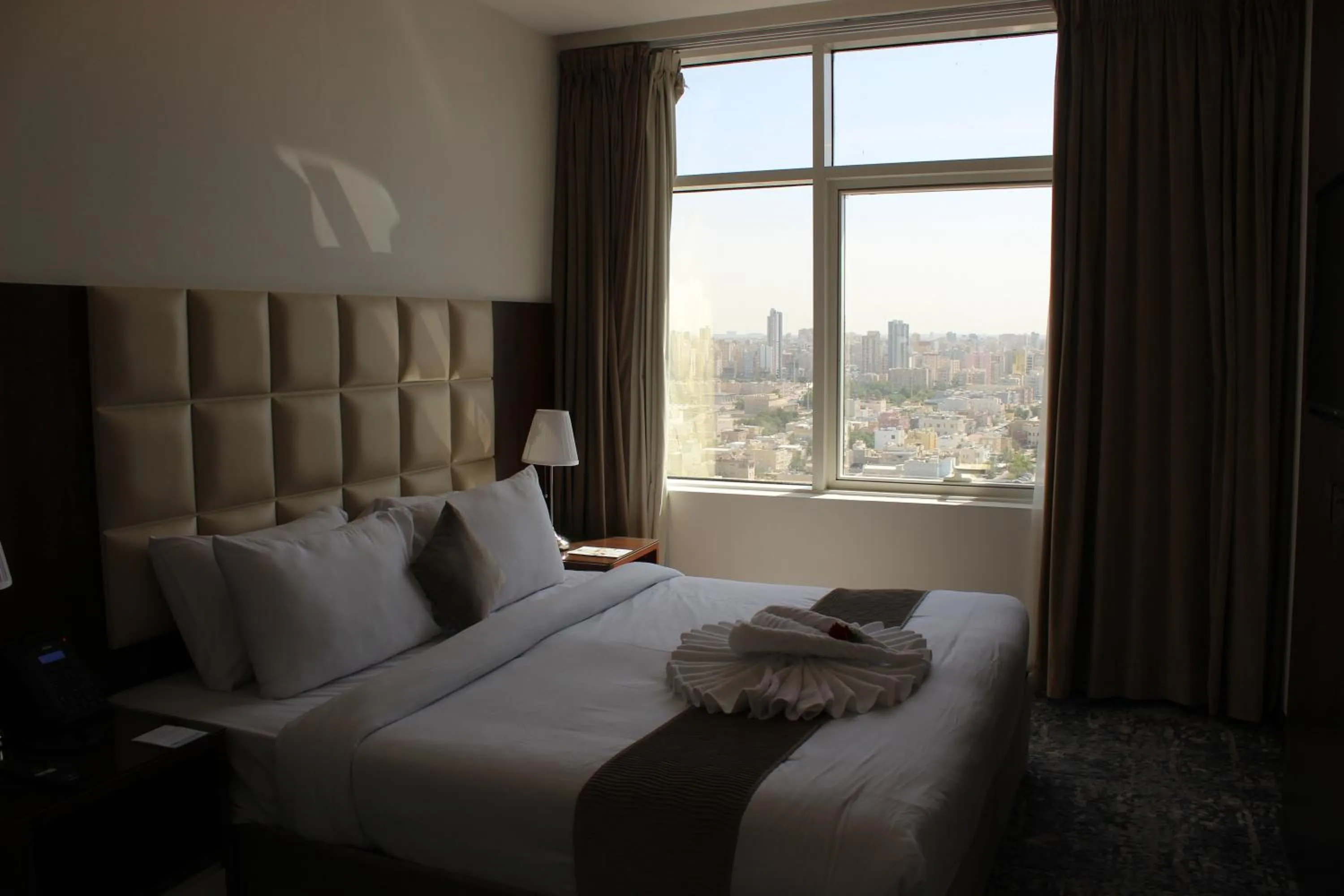 Bed in Dolphin Continental Hotel