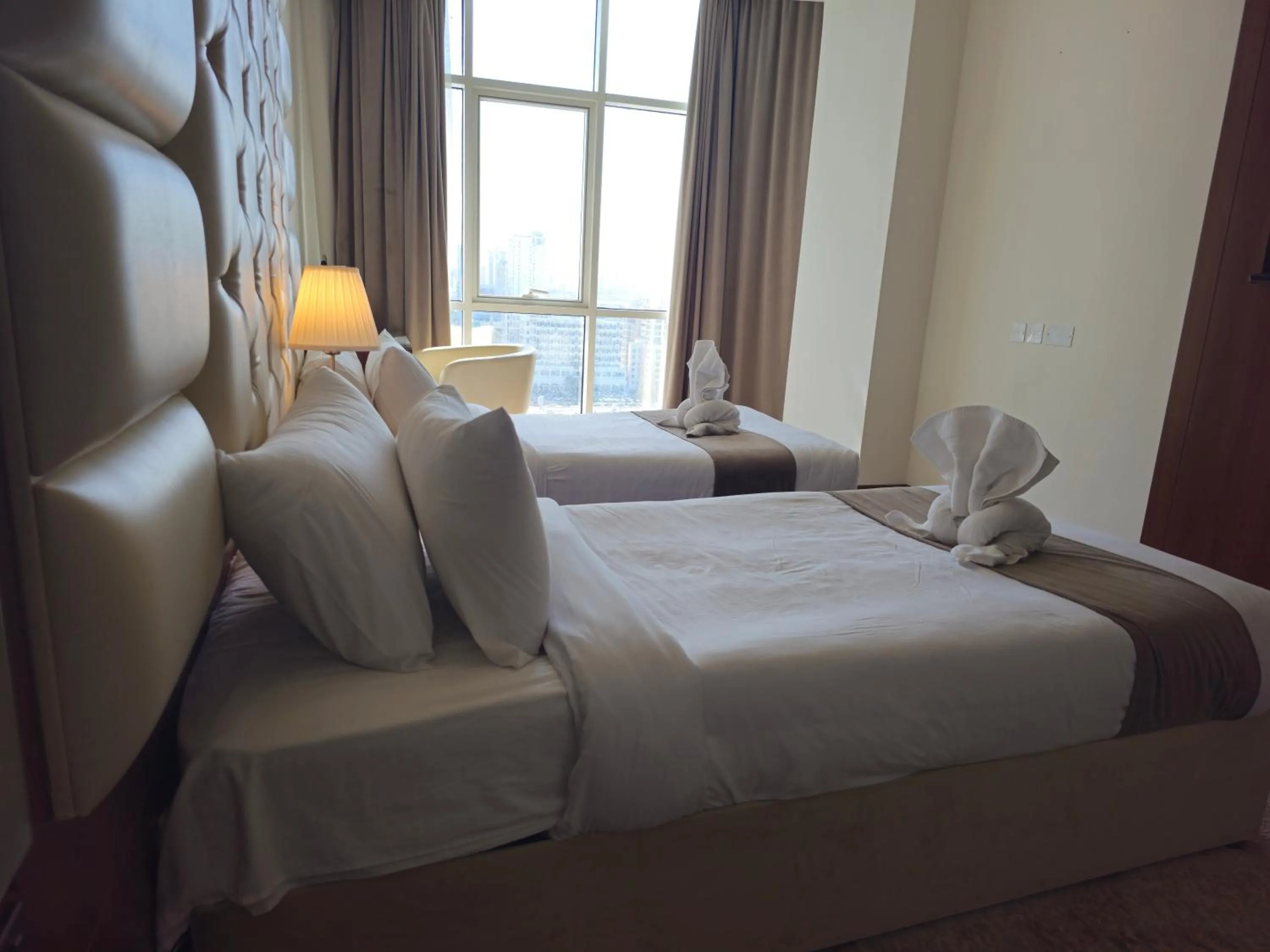 Bed in Dolphin Continental Hotel