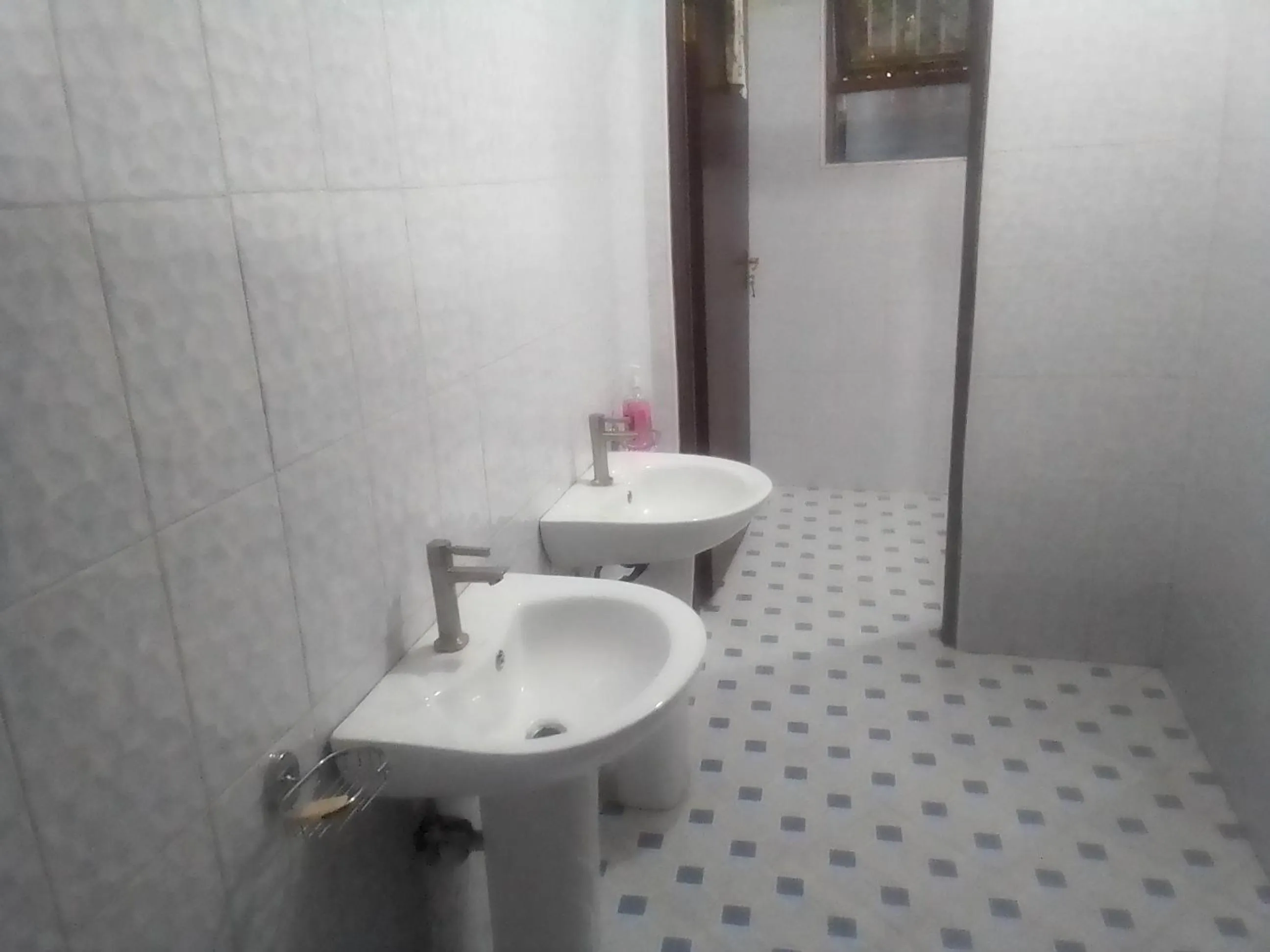 Toilet in DISCOVERY COURTS HOTEL