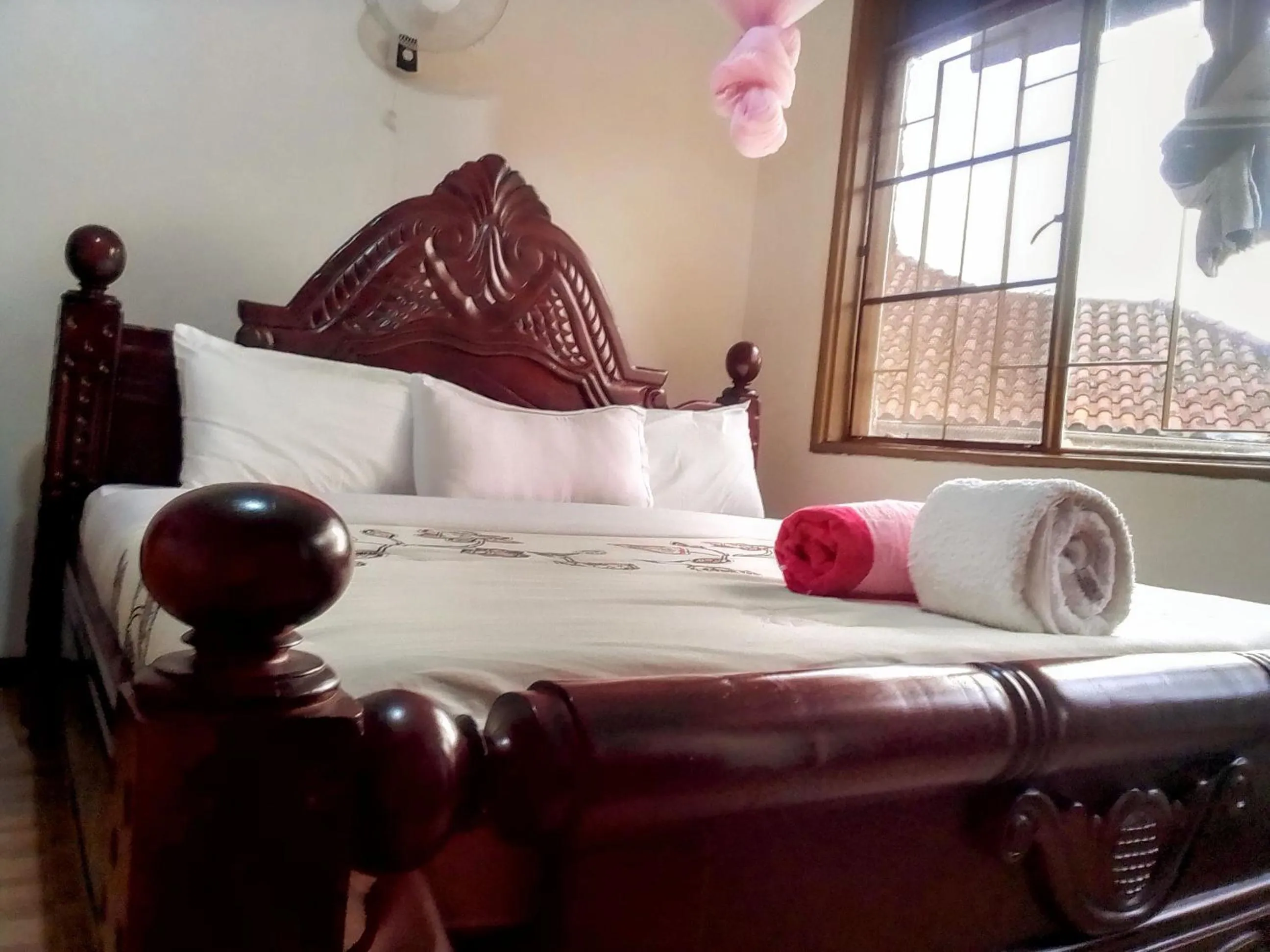 Bed in DISCOVERY COURTS HOTEL