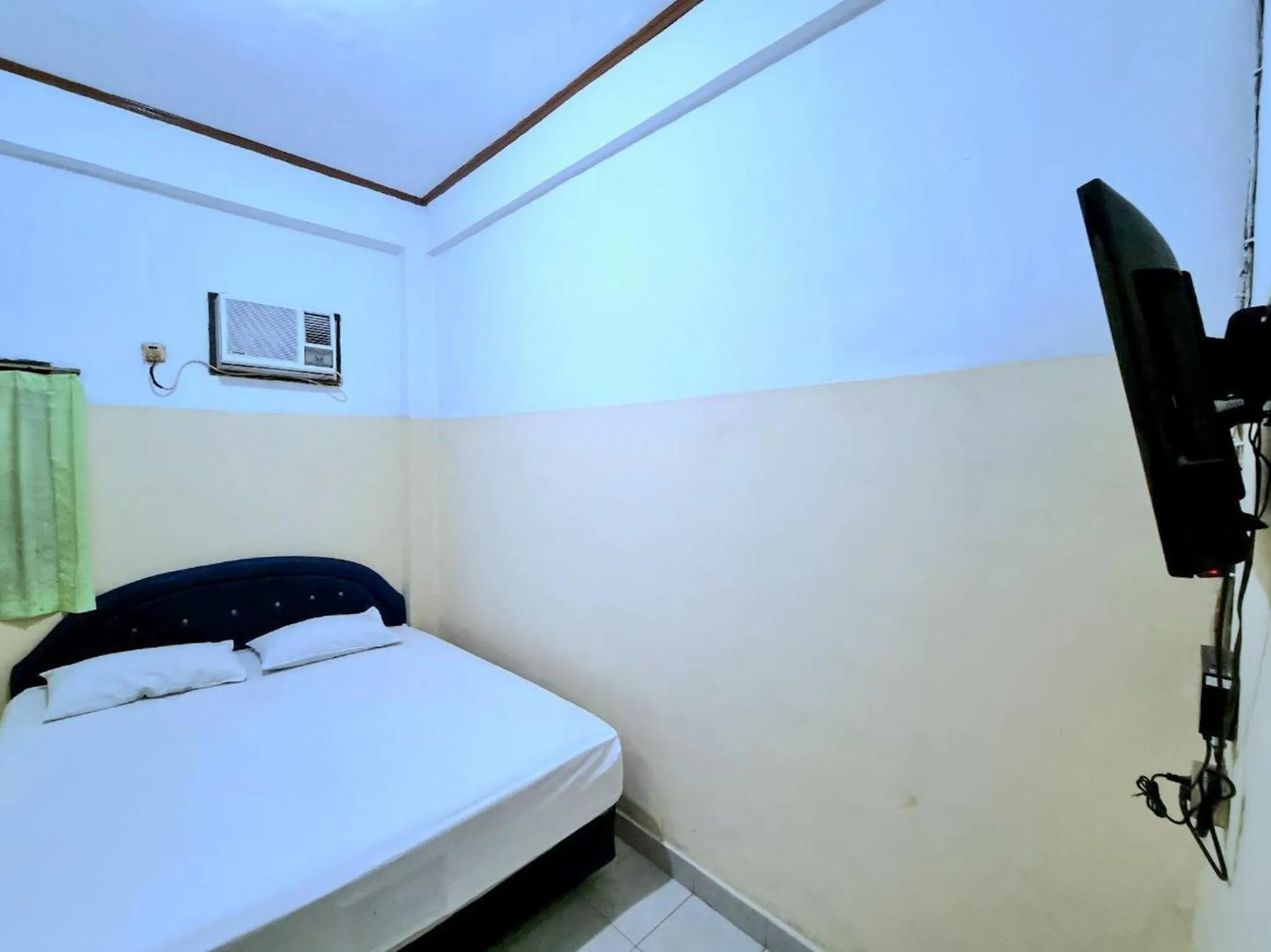 Bed in Hotel Taman Sari