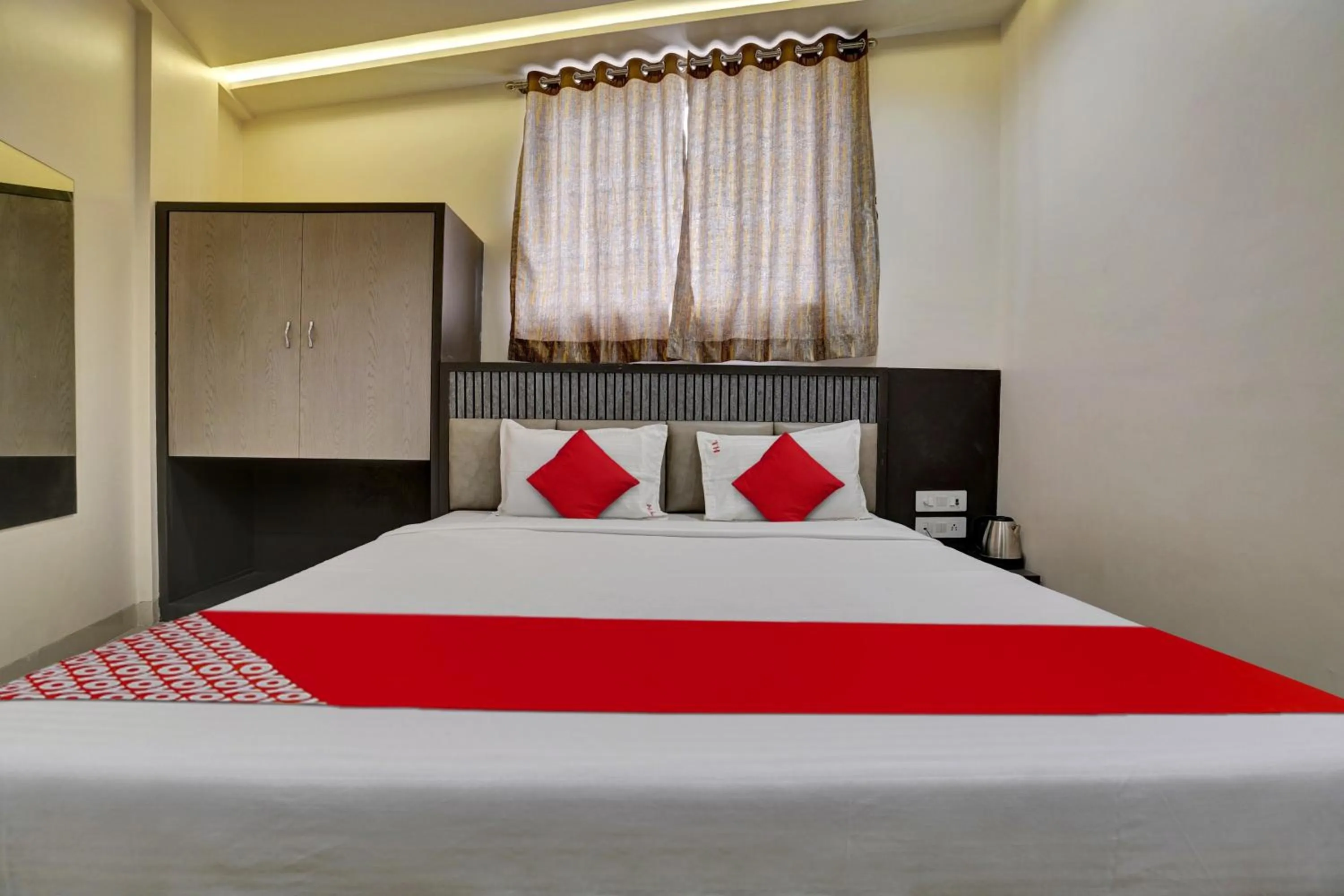Bedroom in Hotel O Dhiman Residency