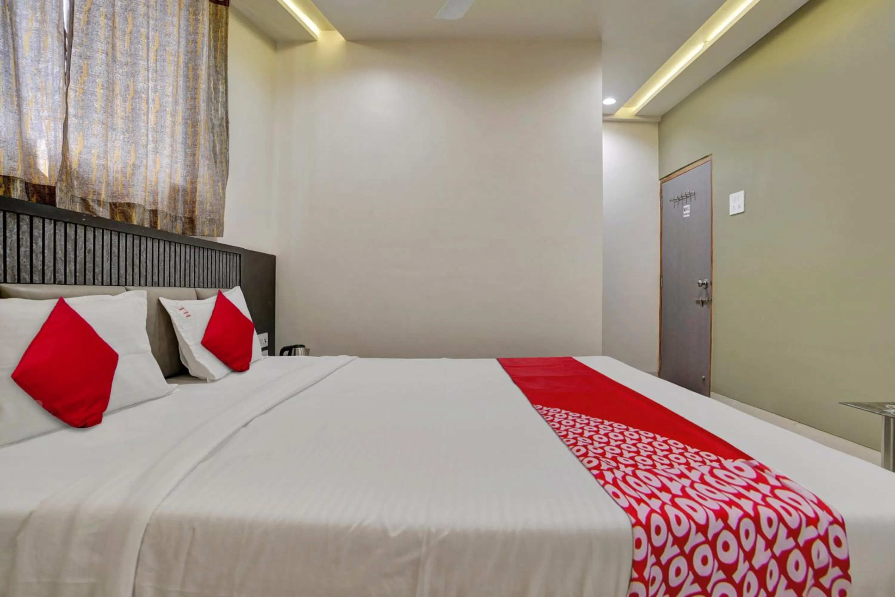 Bedroom in Hotel O Dhiman Residency