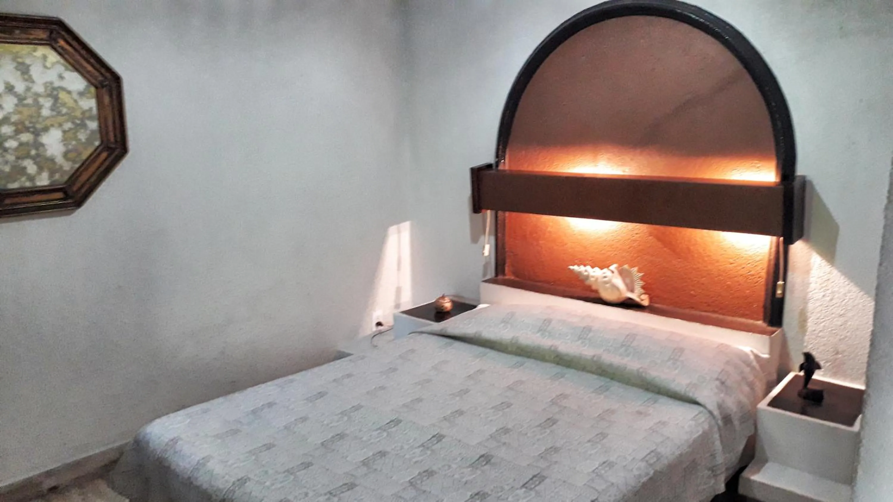 Bed in Solimar Inn Suites