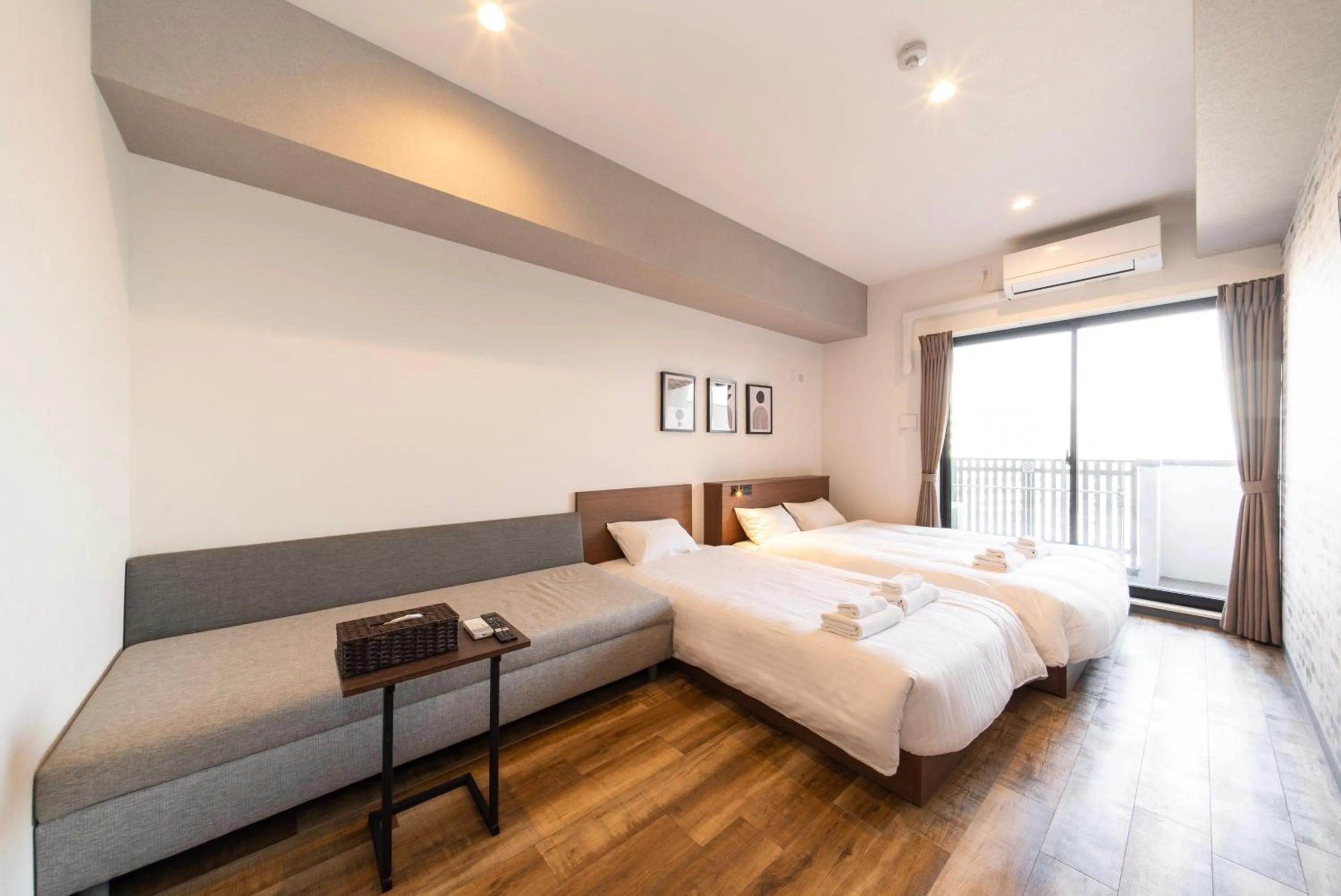 Photo of the whole room, Bed in WELLSTAY Osaka Shinimamiya Station
