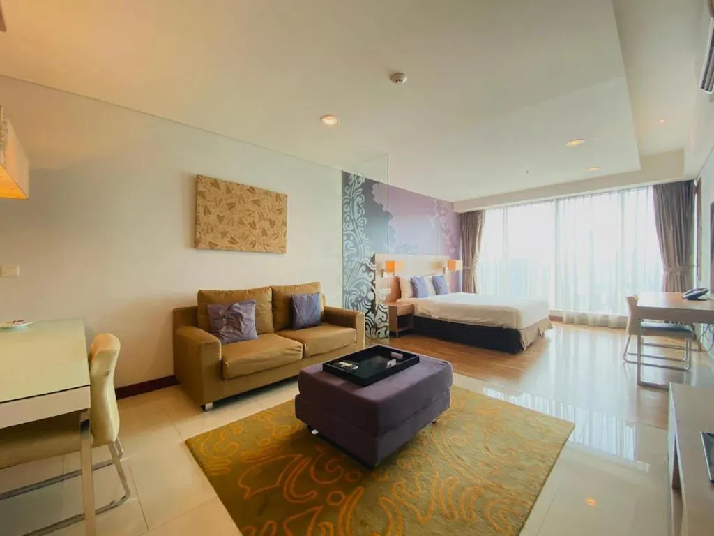 Living room, Bed in The H Tower Rasuna Suites Kuningan Jakarta By Villaloka