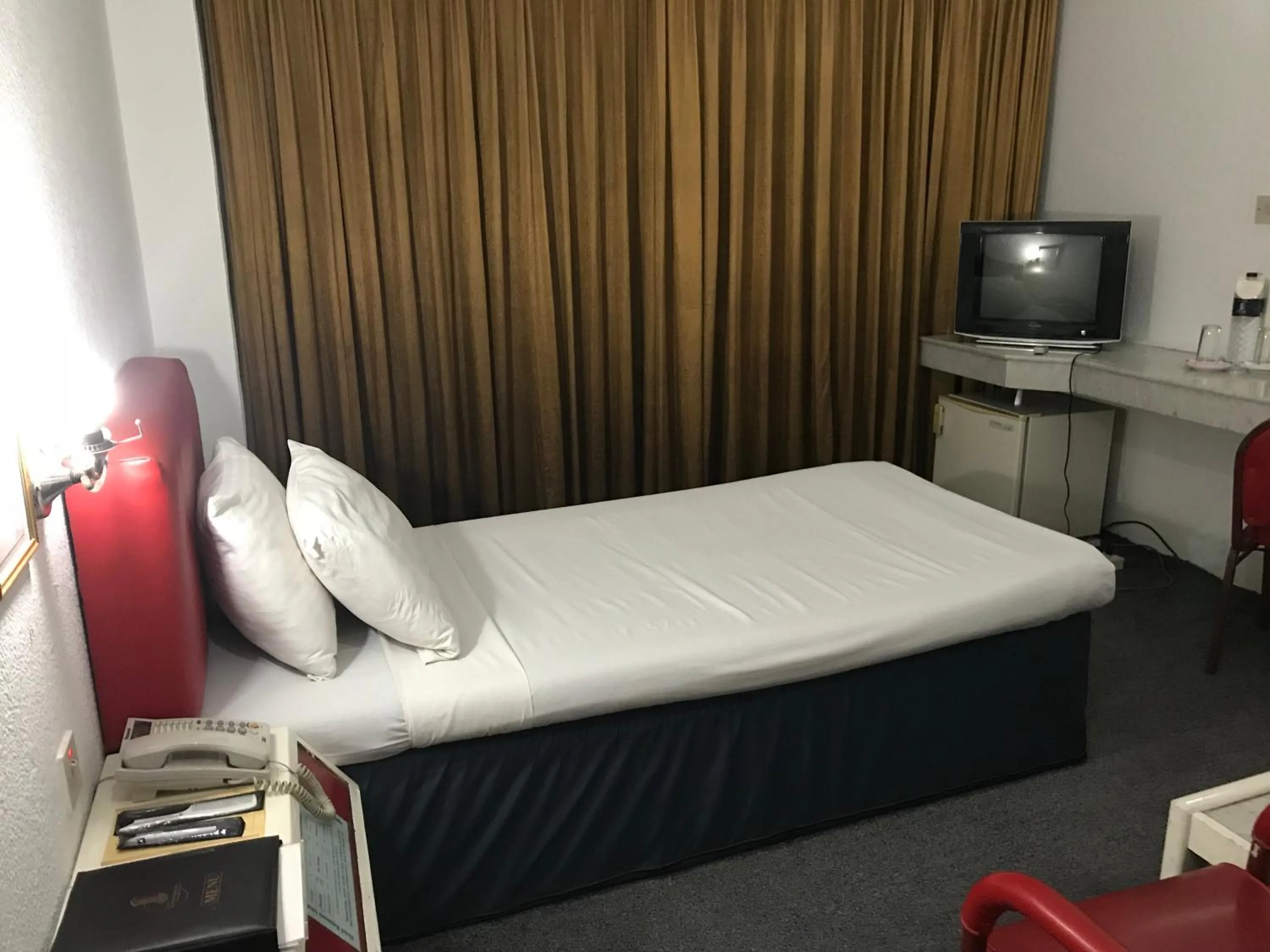 Bed in Hotel Razmoni Isha Kha International