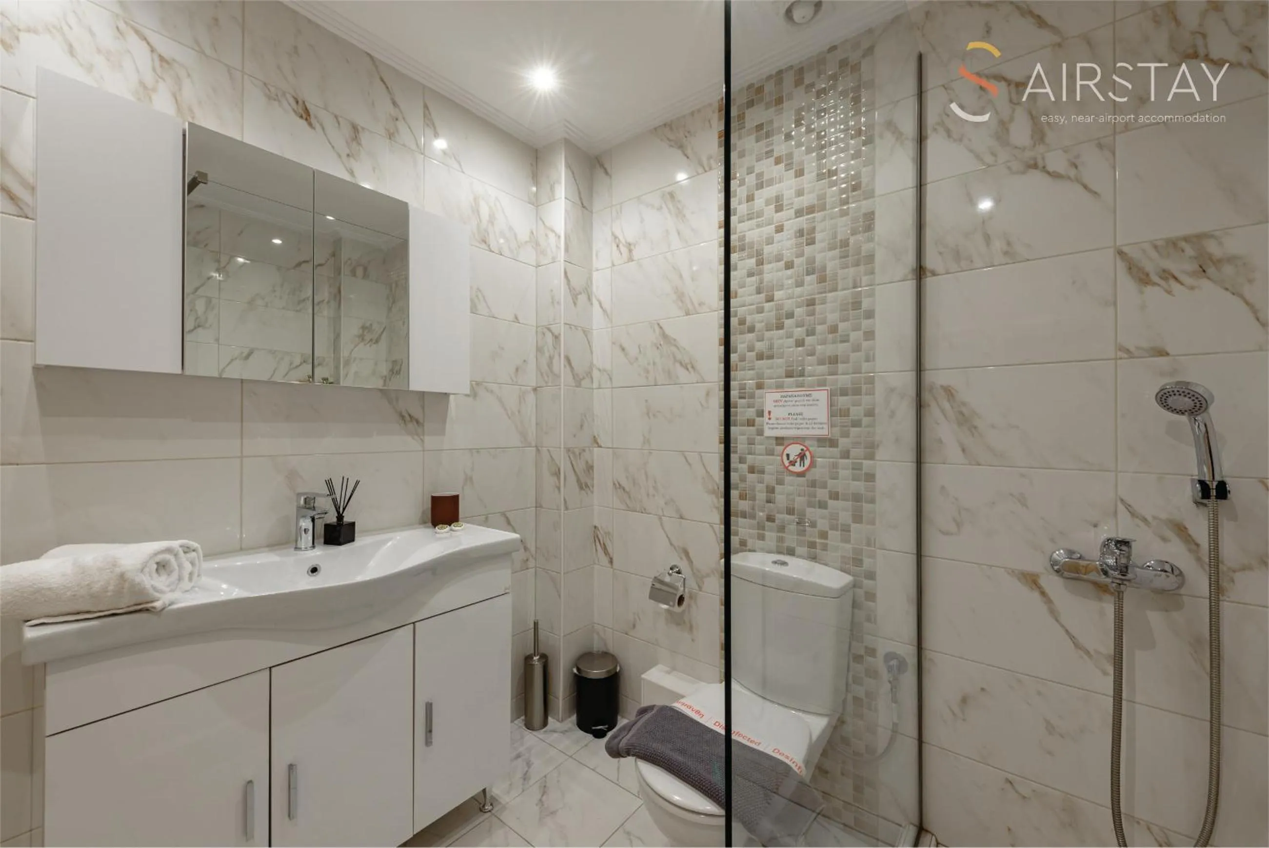 Bathroom in Zilean Apartments Airport by Airstay