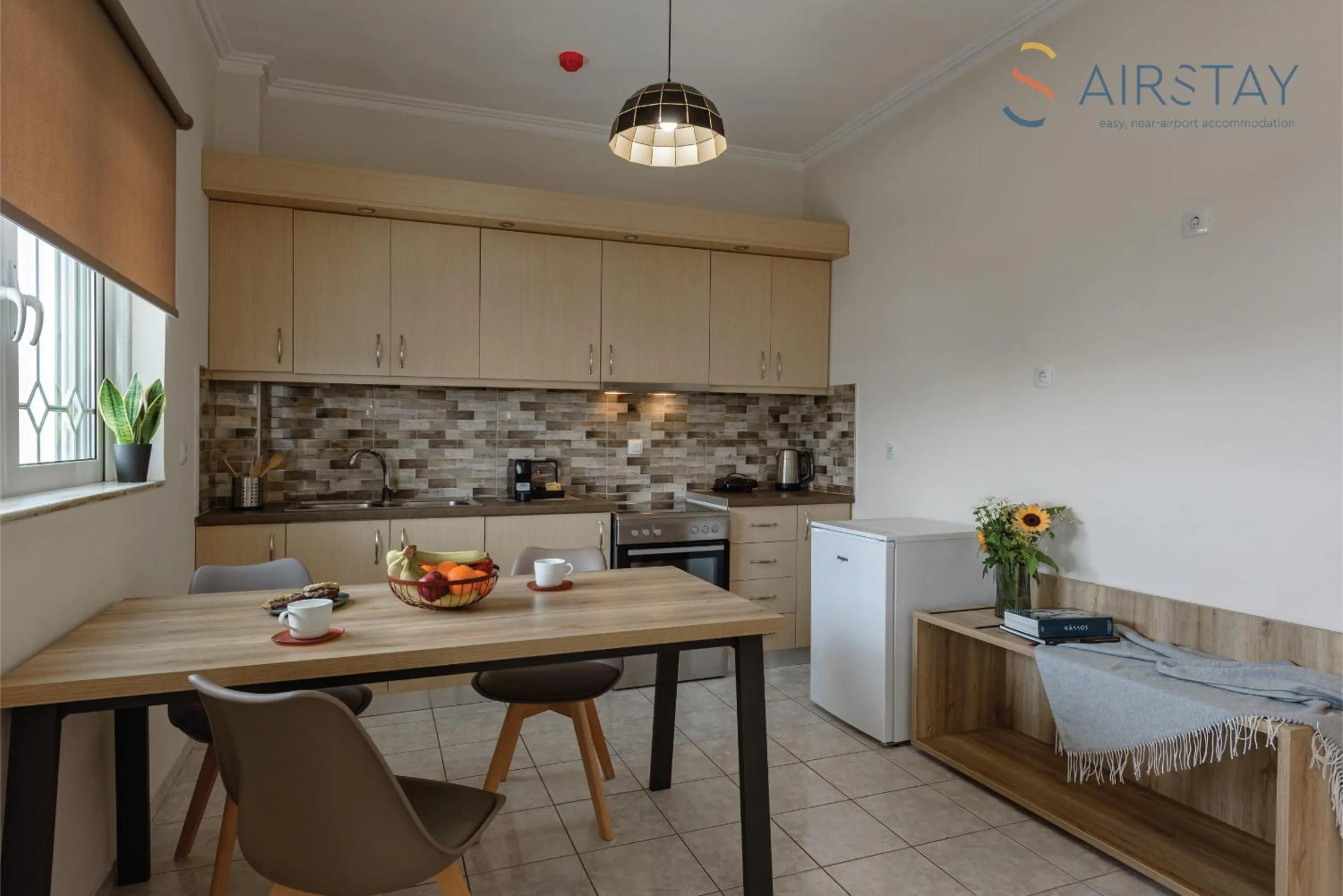 kitchen in Zilean Apartments Airport by Airstay
