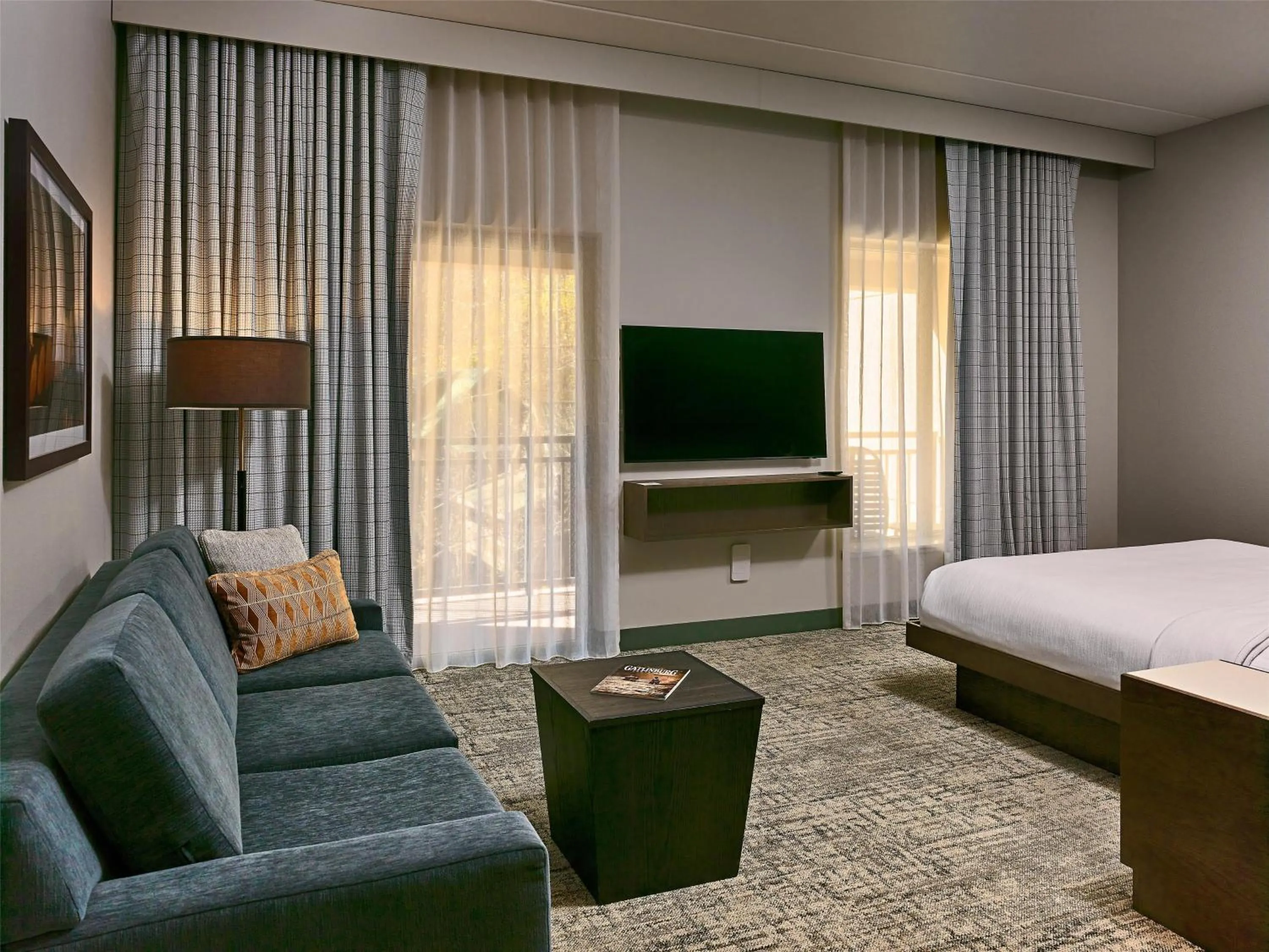 Living room, Bed in Embassy Suites By Hilton Gatlinburg Resort