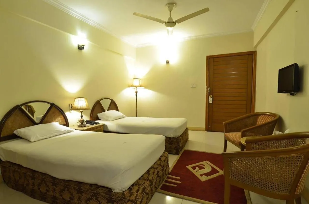 Bed in Pak Continental Hotel