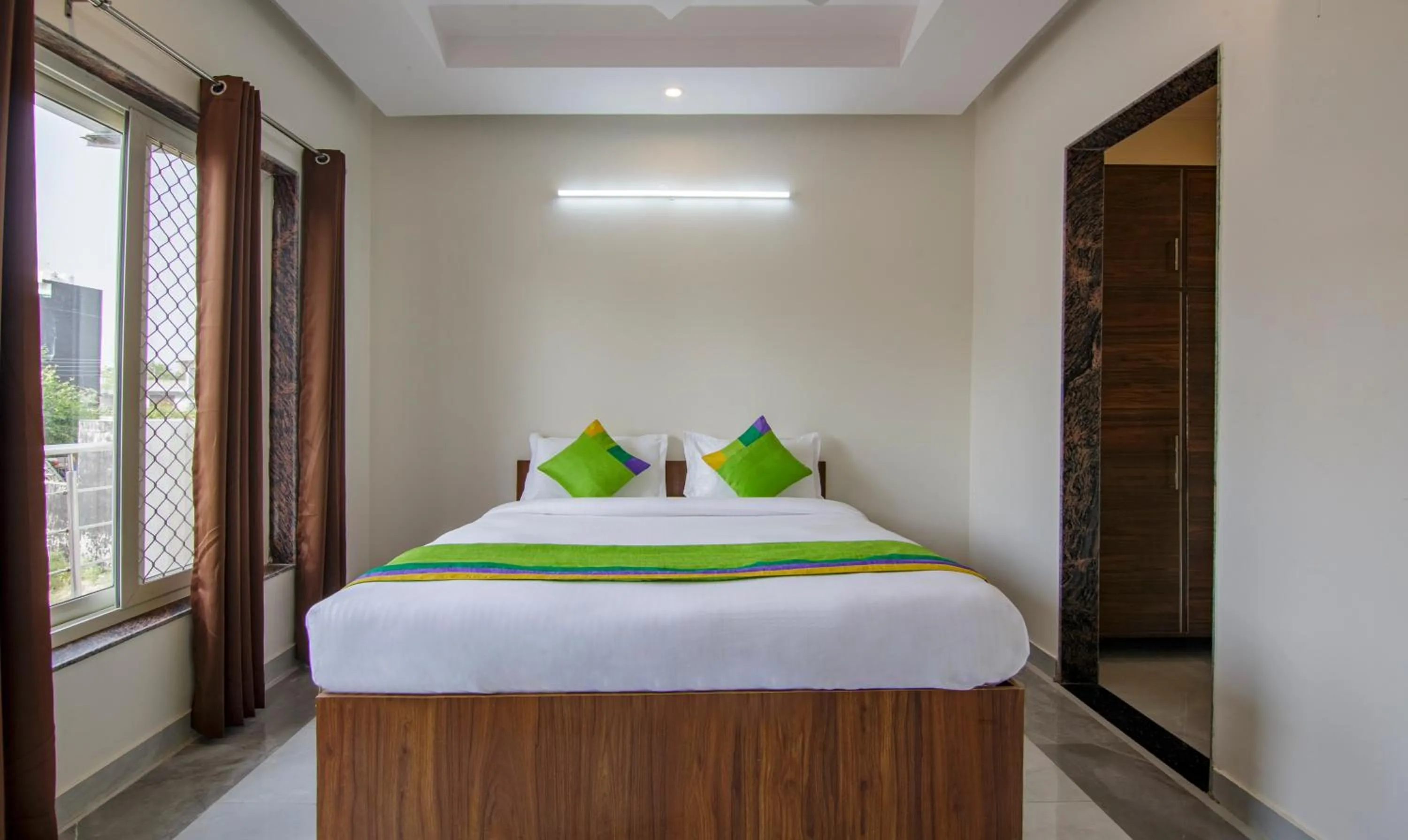 Bedroom, Bed in Treebo Grand Vista - 63A