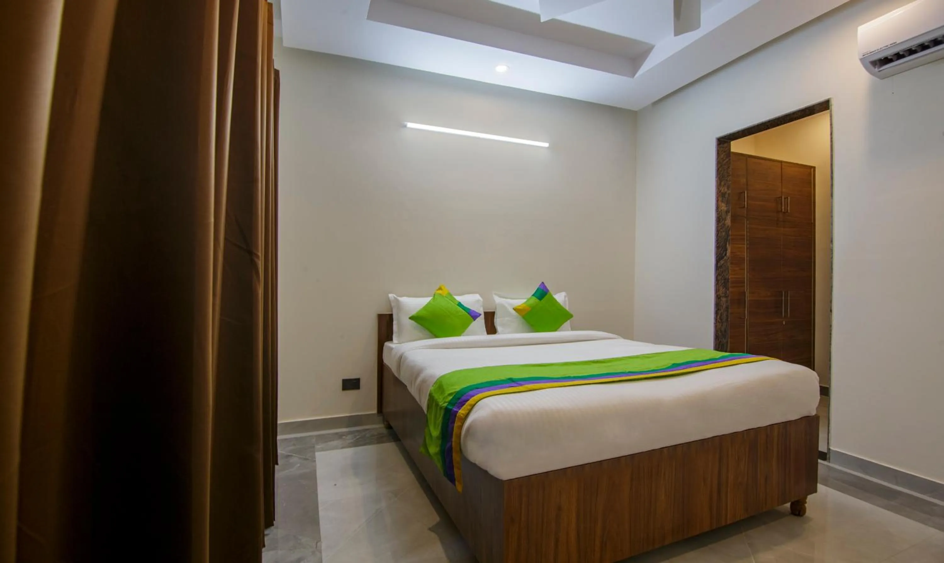 Bedroom, Bed in Treebo Grand Vista - 63A