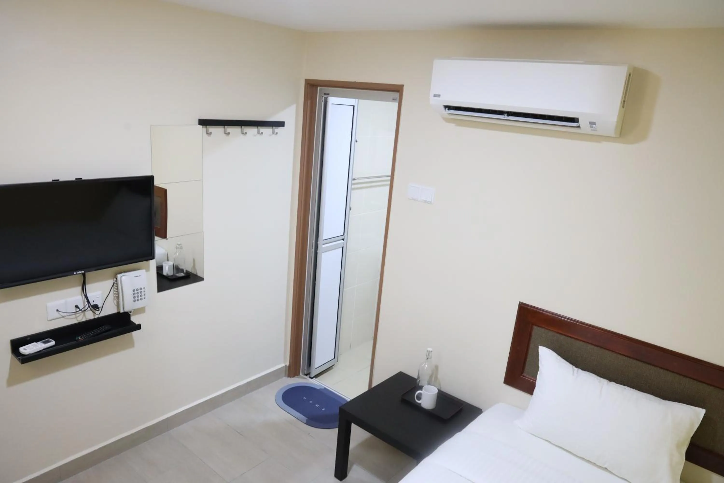 Bedroom, Bed in Capital O 90897 Island City Hotel