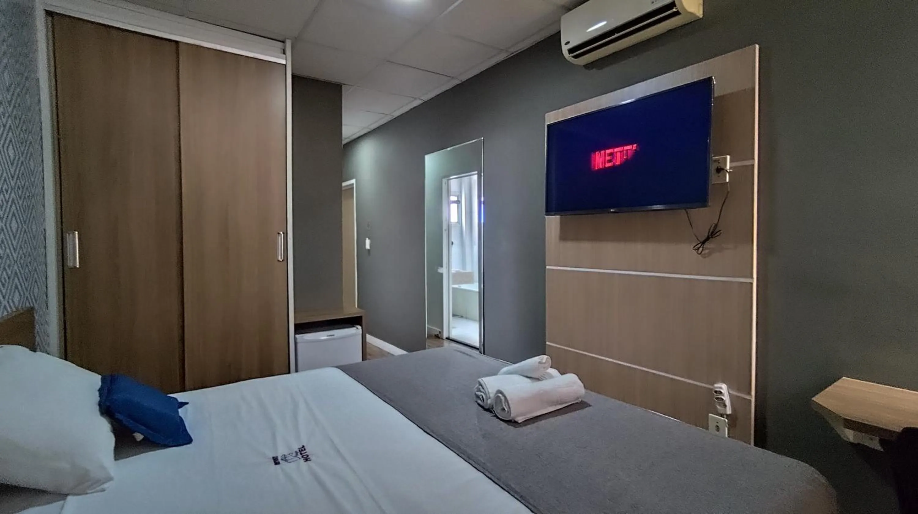 Bed in Assay Plaza Hotel