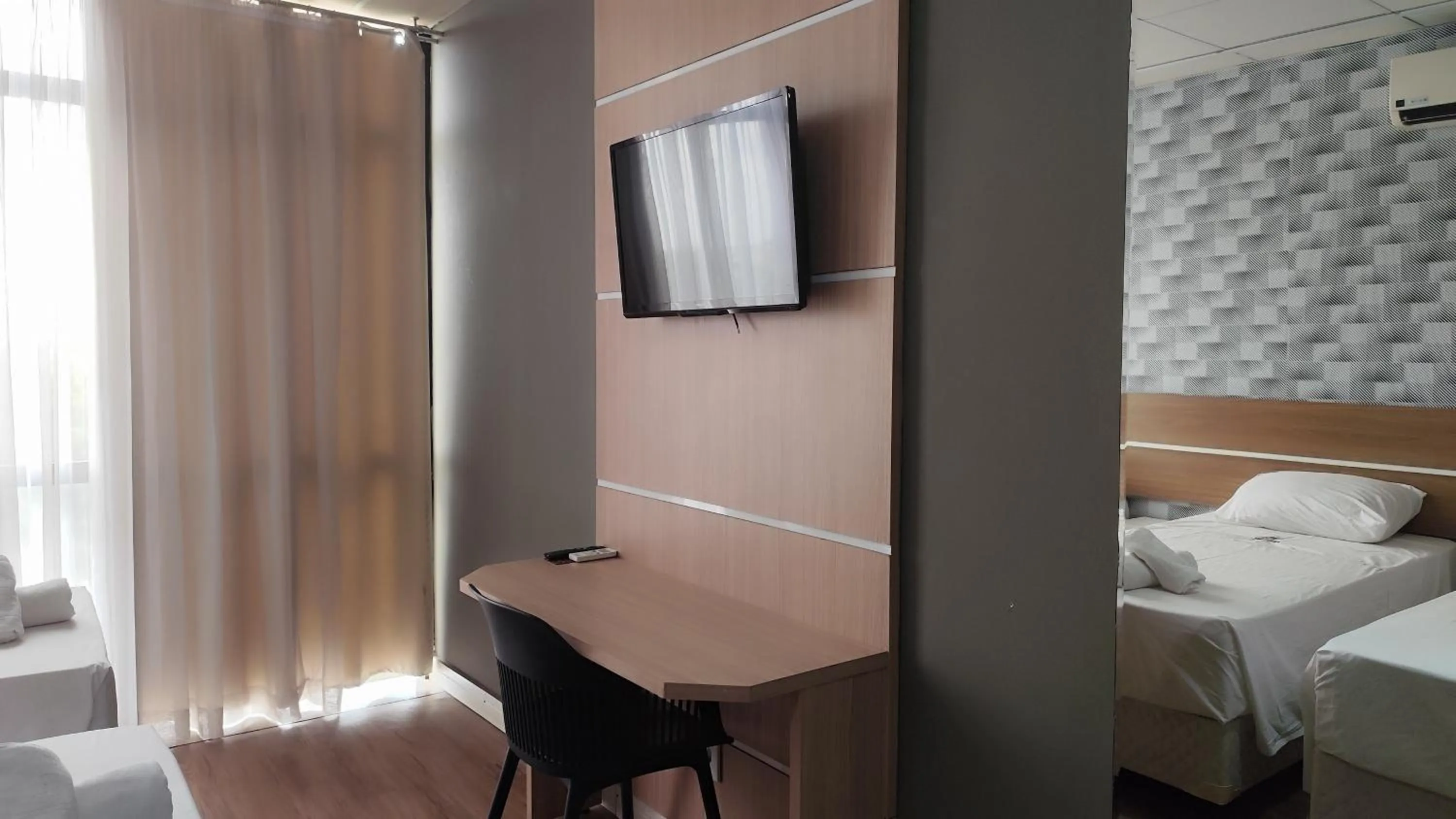 Bed in Assay Plaza Hotel