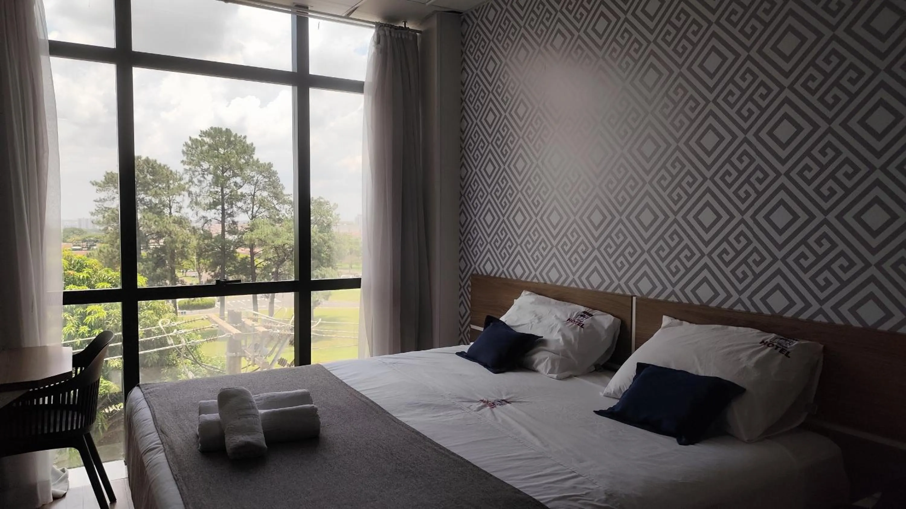 Bed in Assay Plaza Hotel