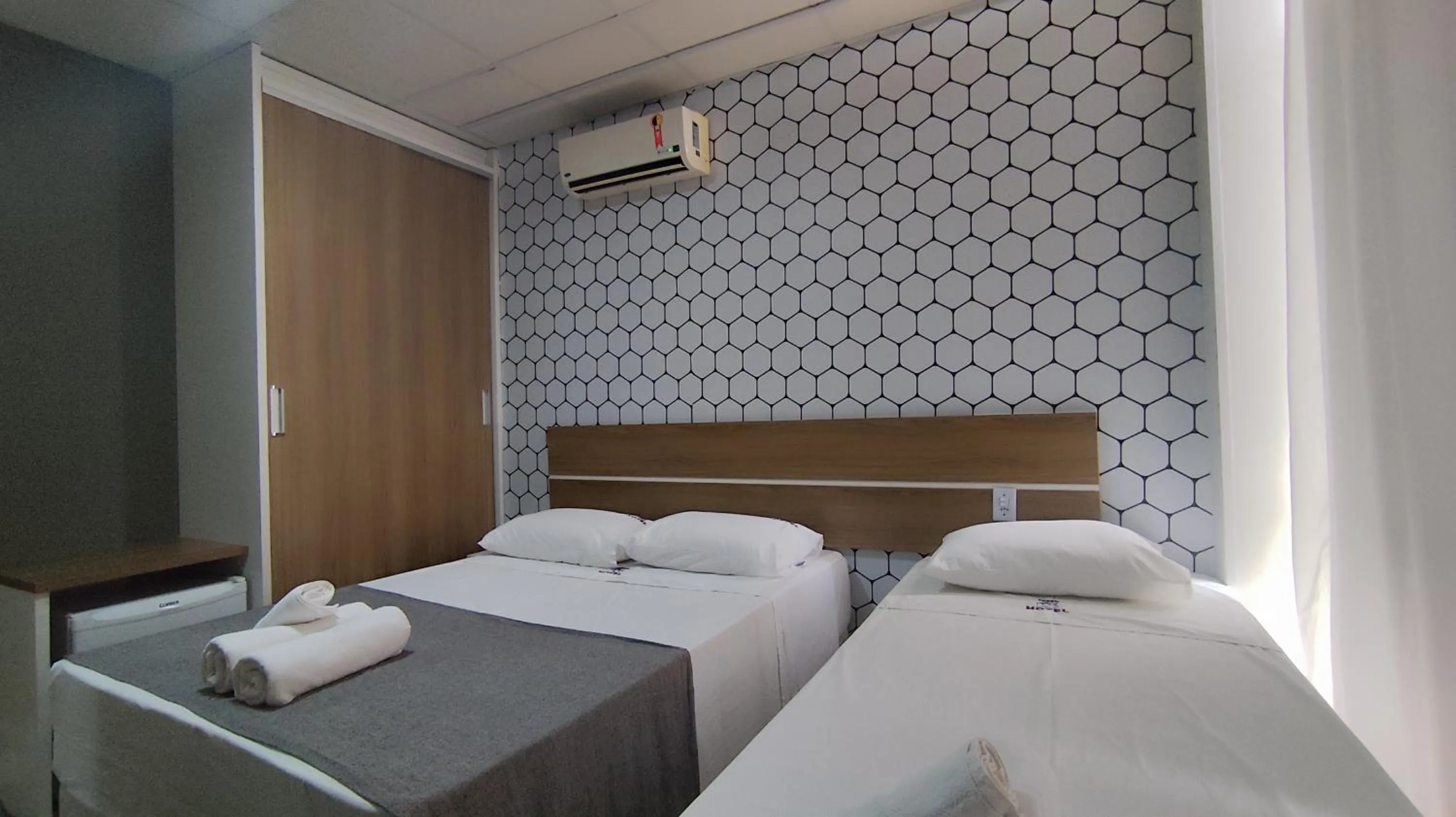 Bed in Assay Plaza Hotel