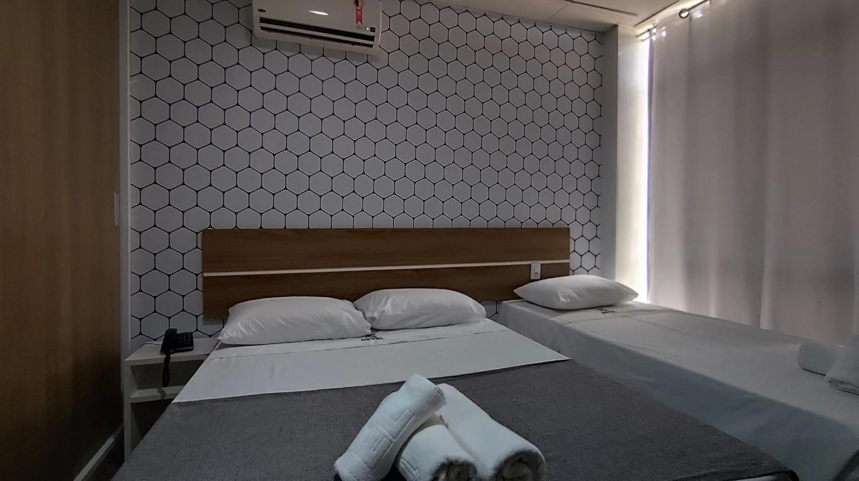 Bed in Assay Plaza Hotel