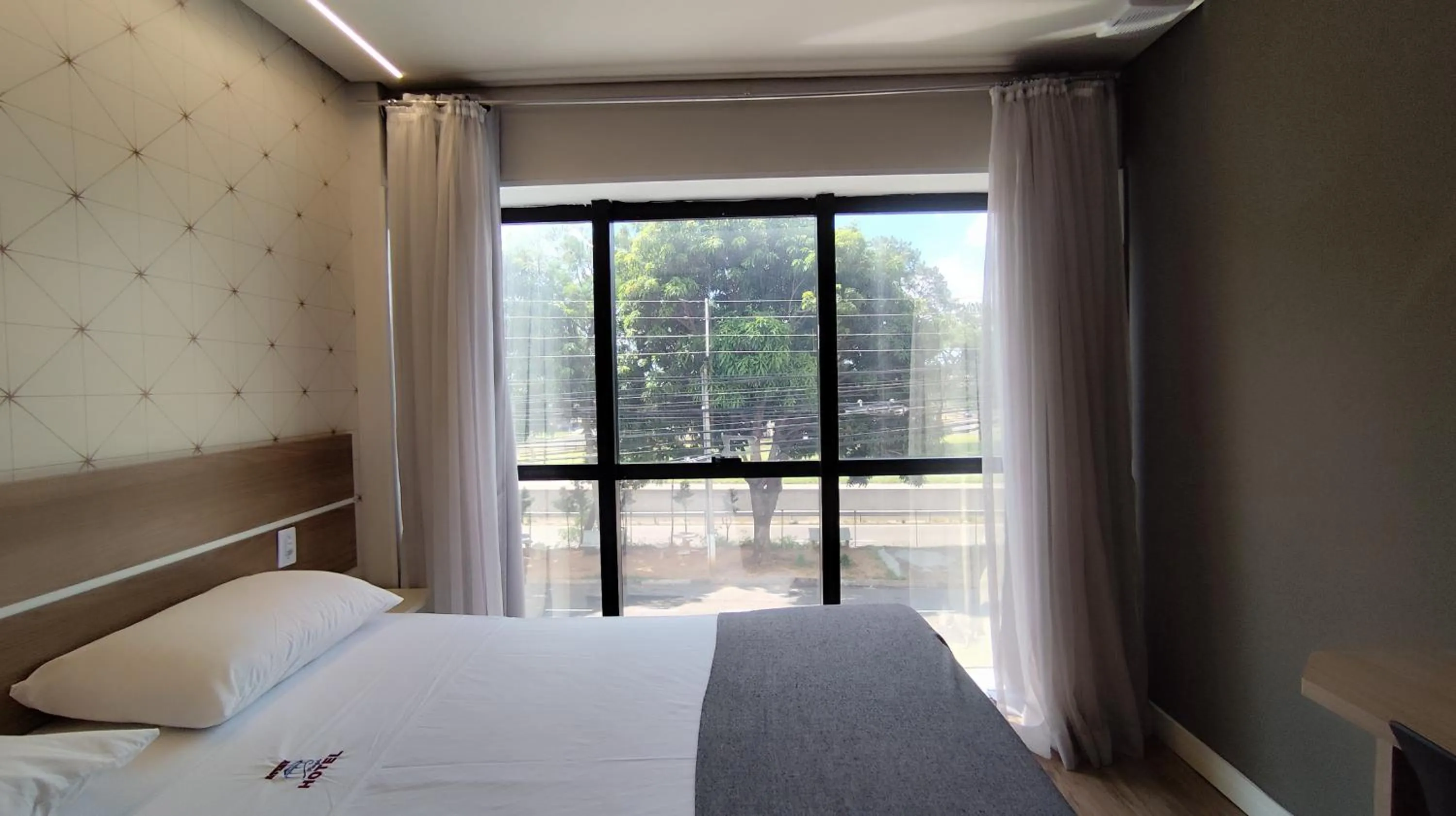 Bed in Assay Plaza Hotel