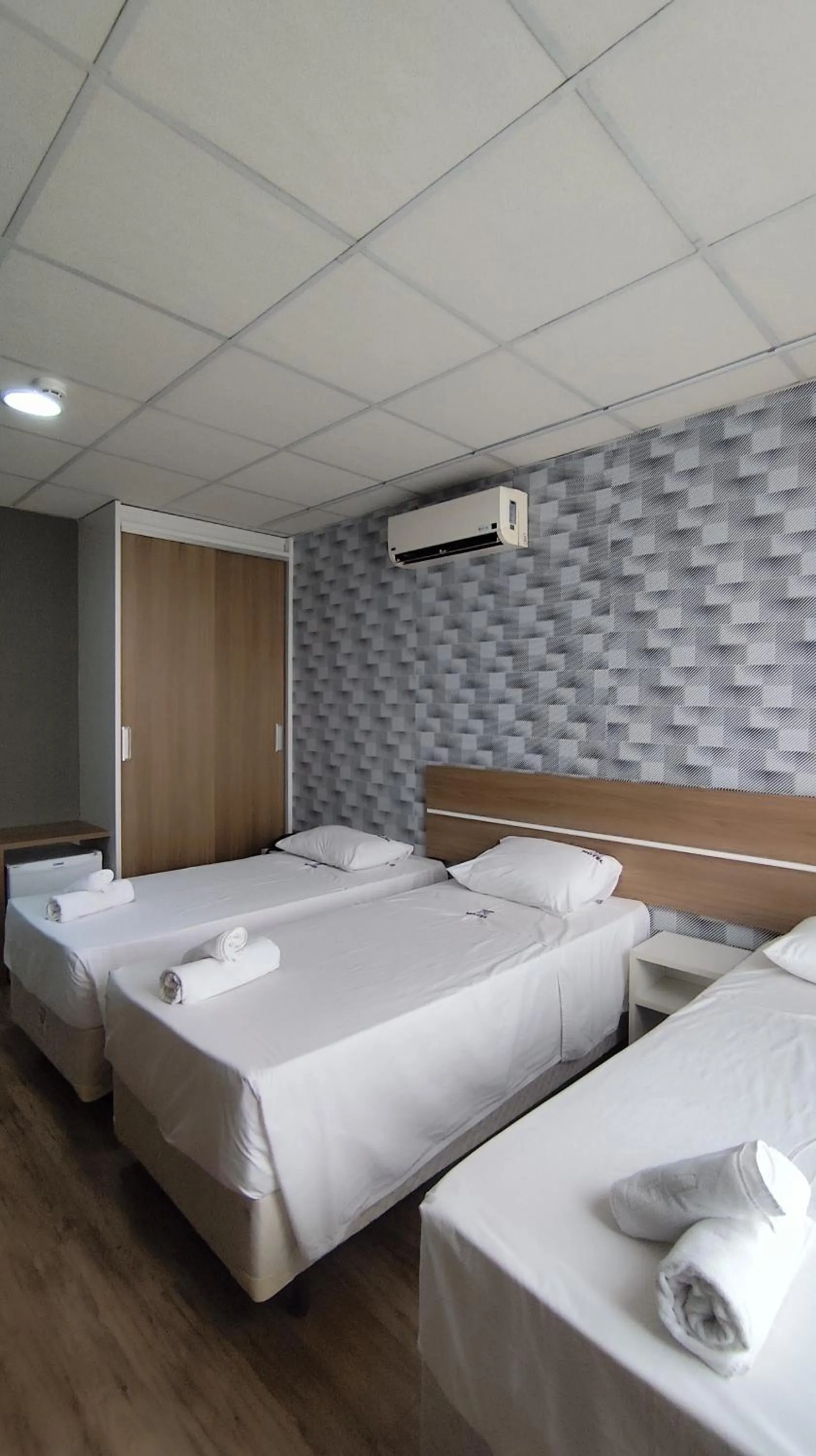 Bed in Assay Plaza Hotel