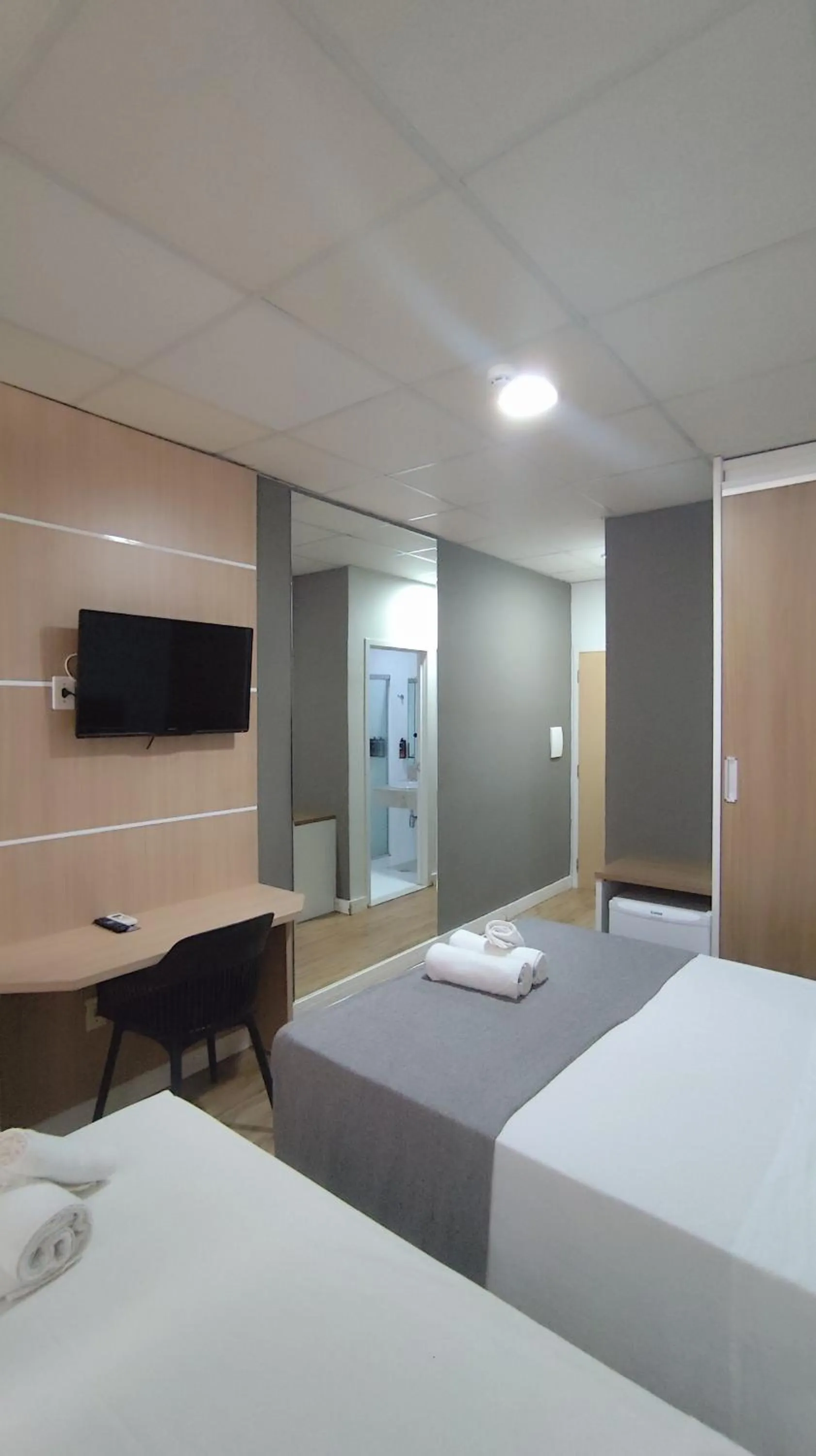 Bed in Assay Plaza Hotel