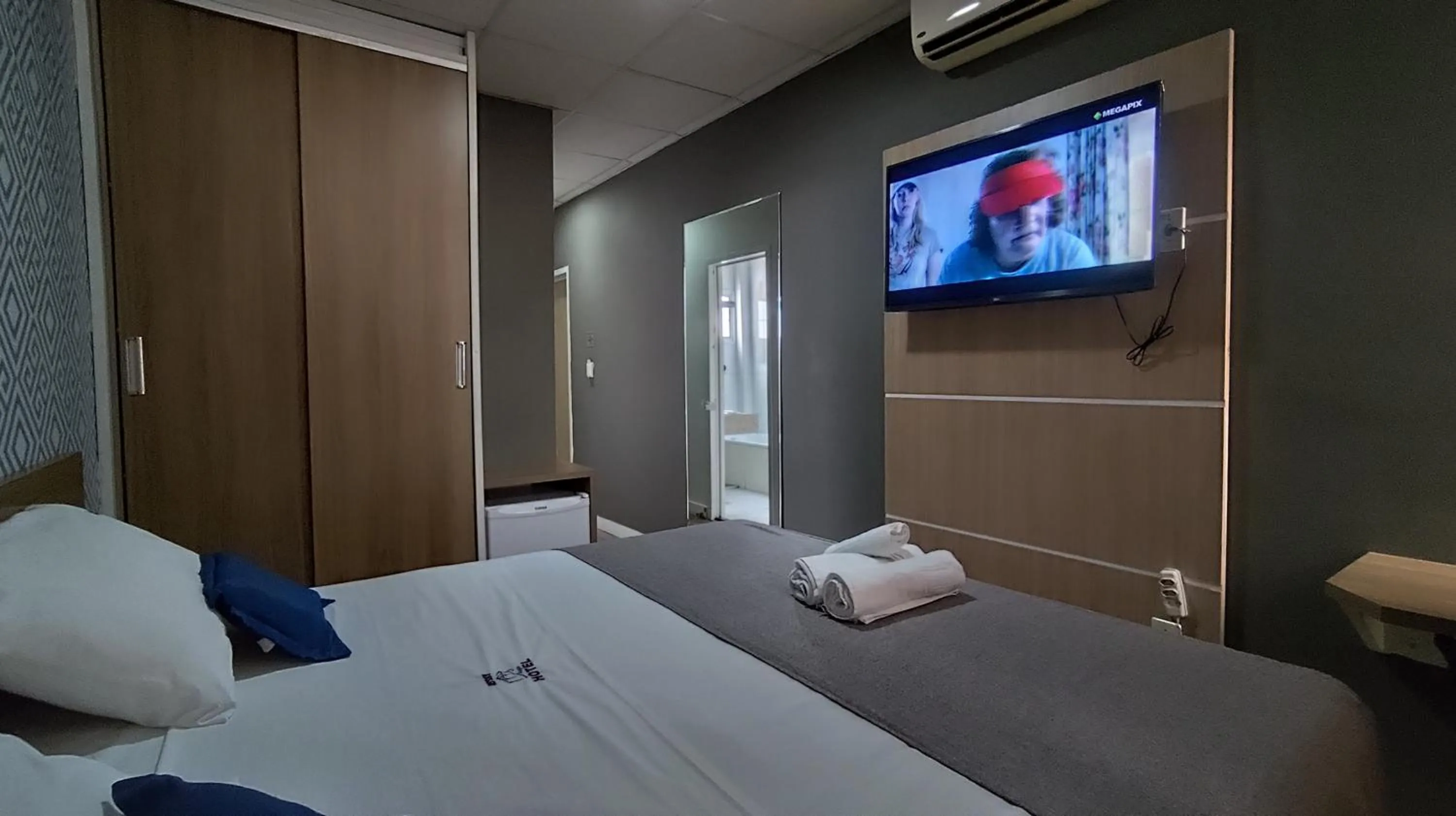 Bed in Assay Plaza Hotel