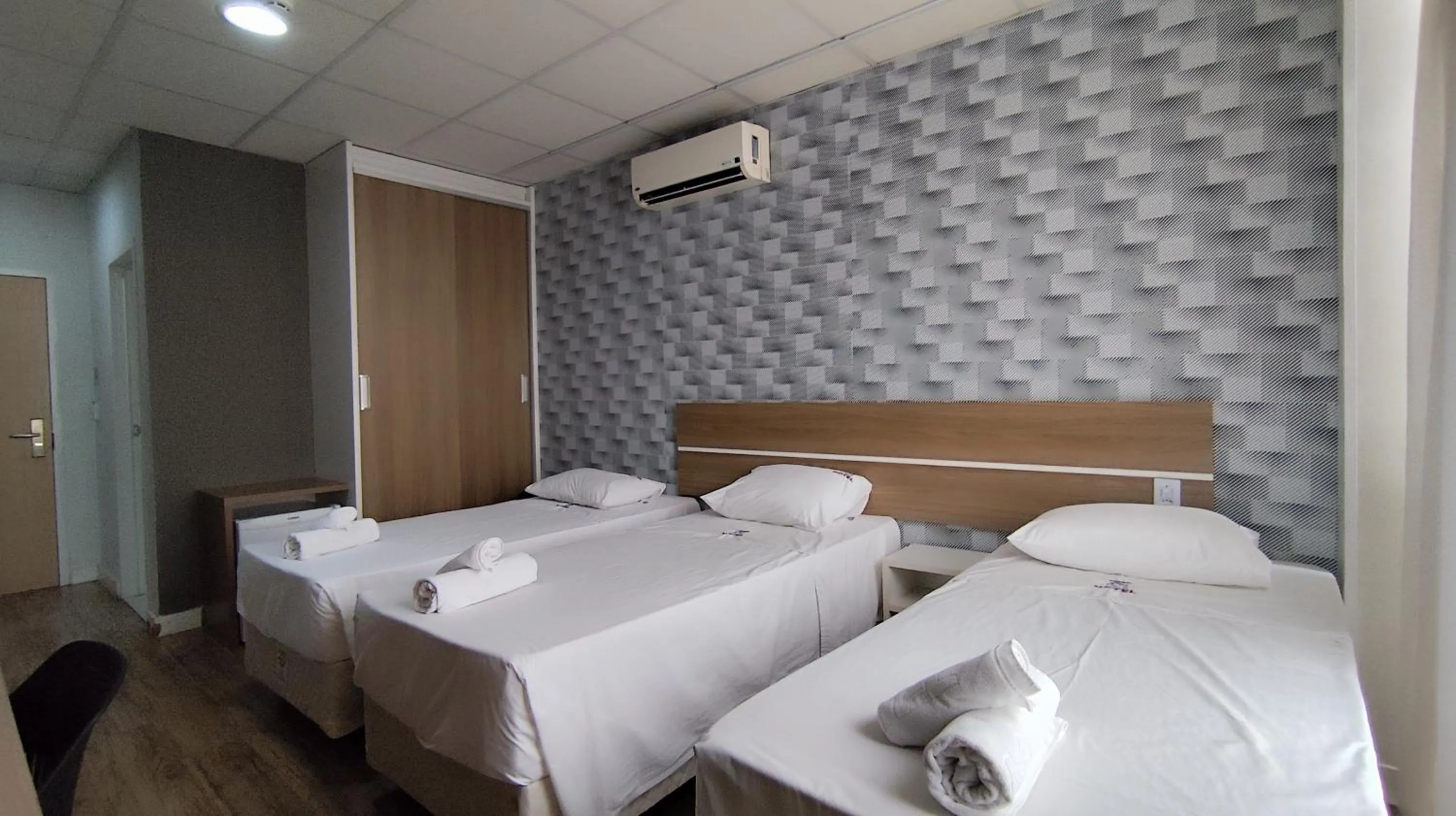 Bed in Assay Plaza Hotel