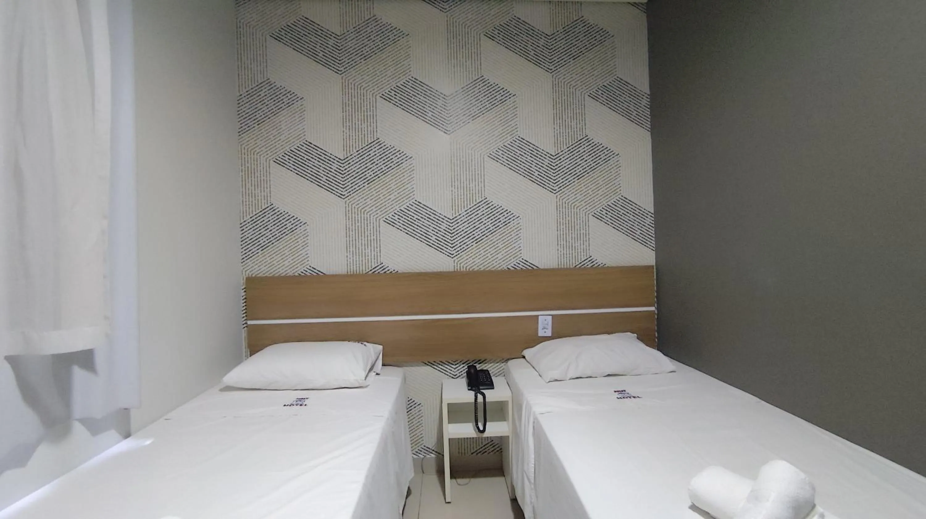 Bed in Assay Plaza Hotel