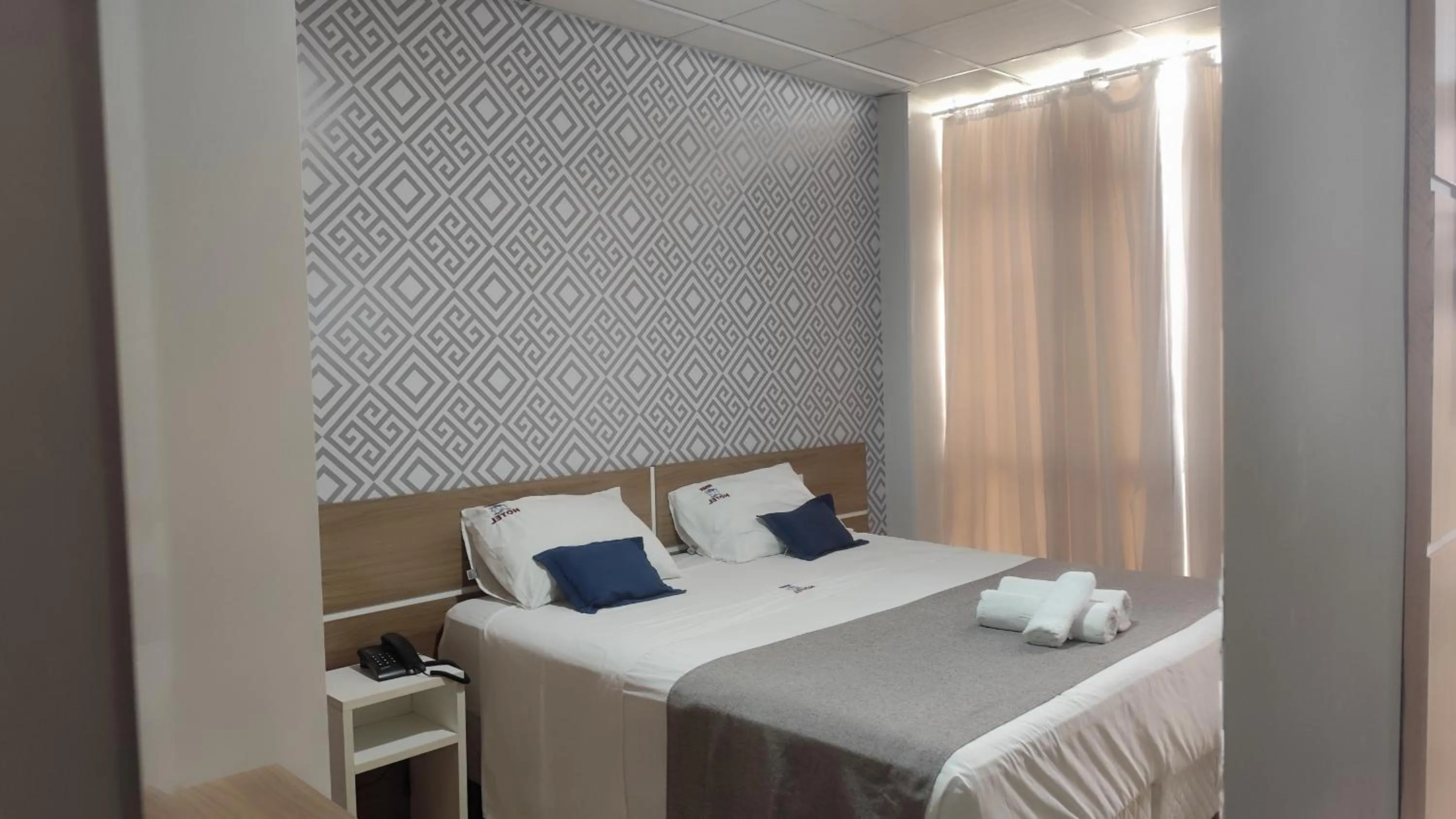 Bed in Assay Plaza Hotel