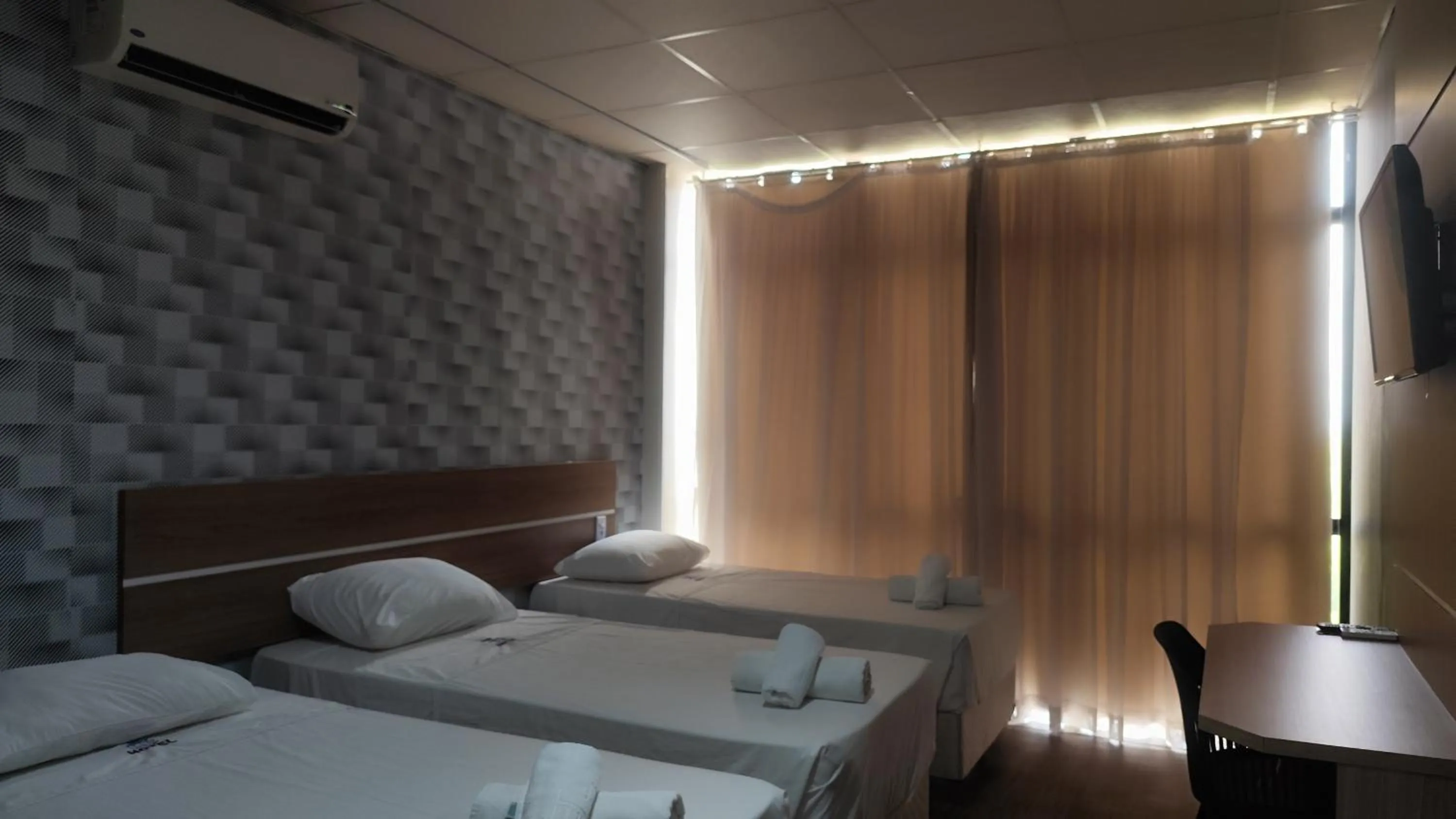 Bed in Assay Plaza Hotel