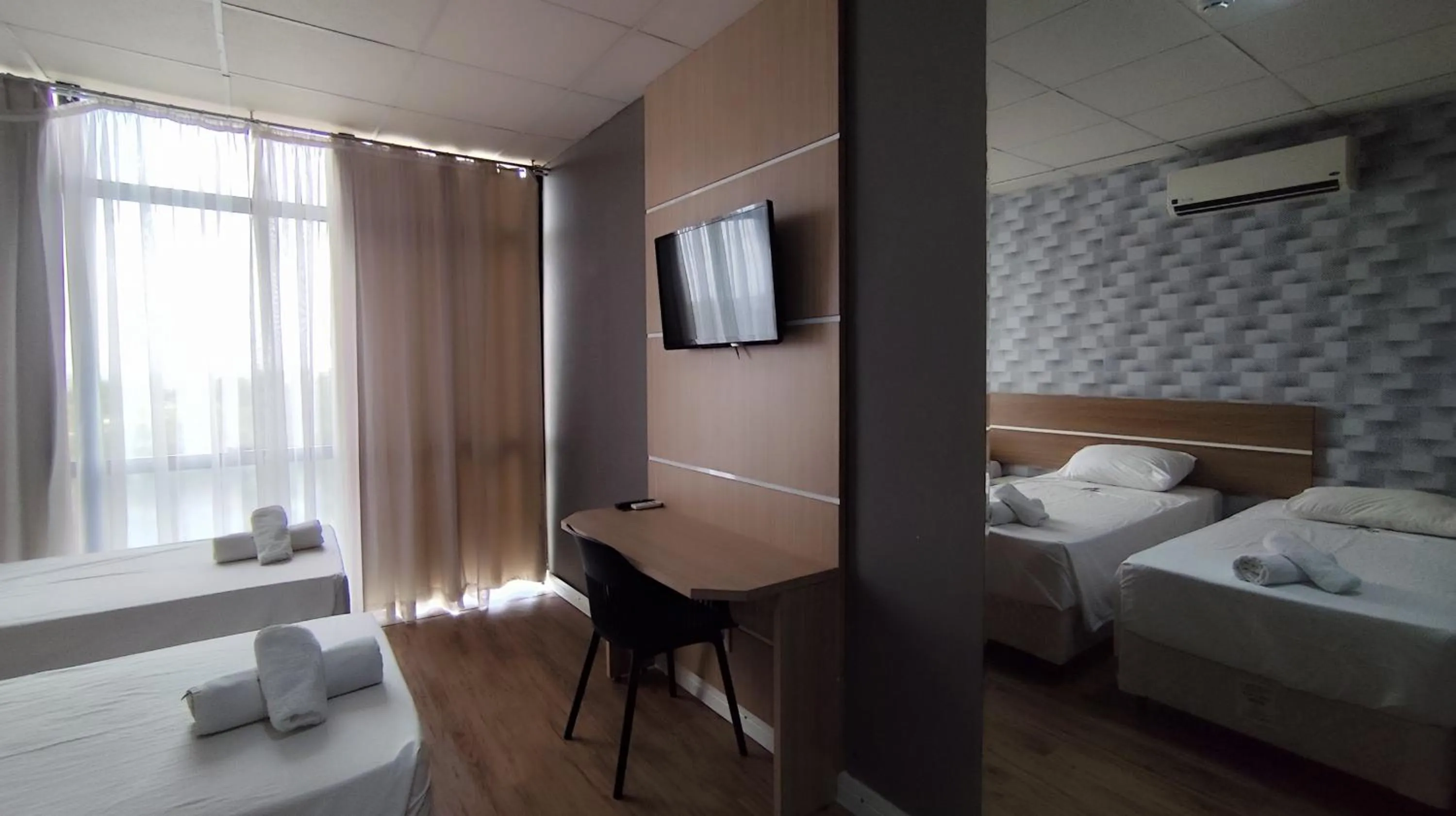 Bed in Assay Plaza Hotel