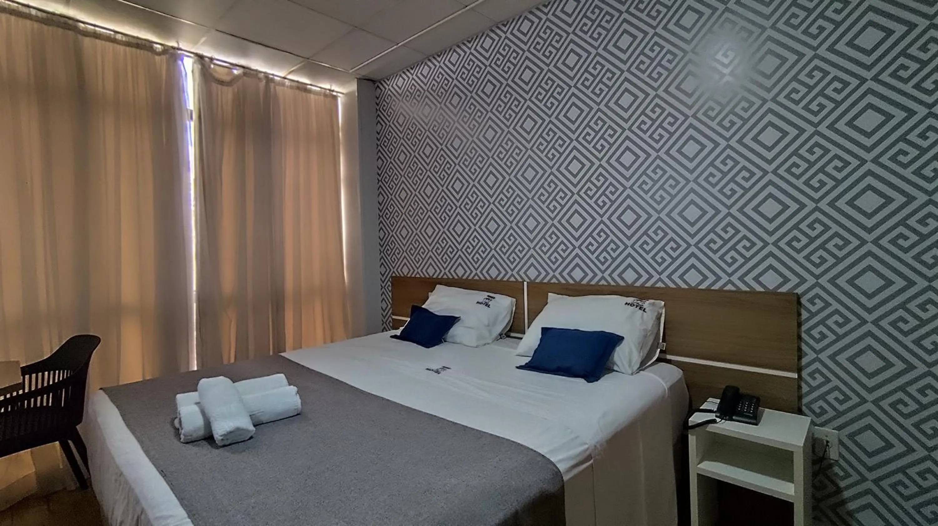 Bed in Assay Plaza Hotel