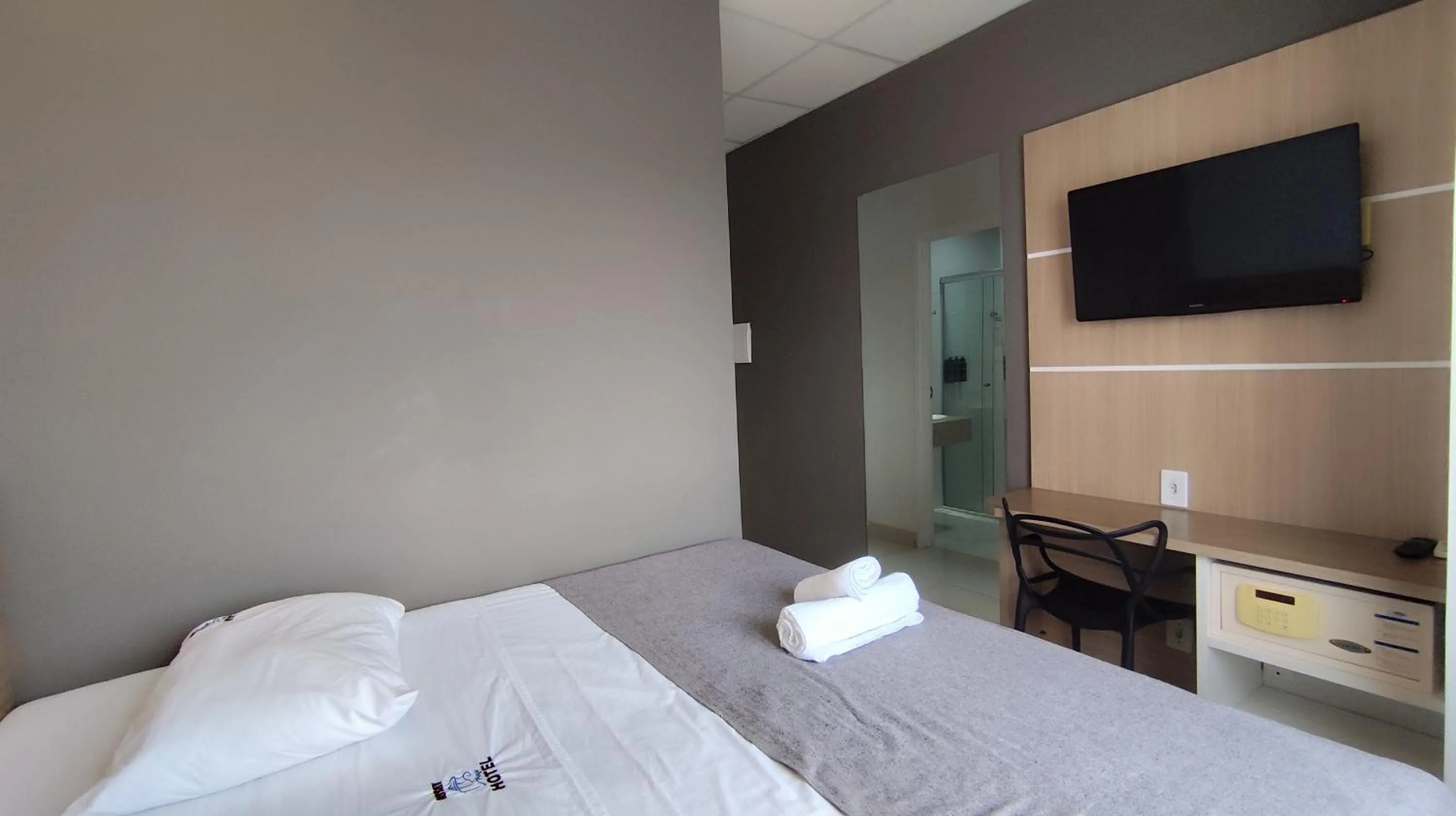 Bed in Assay Plaza Hotel