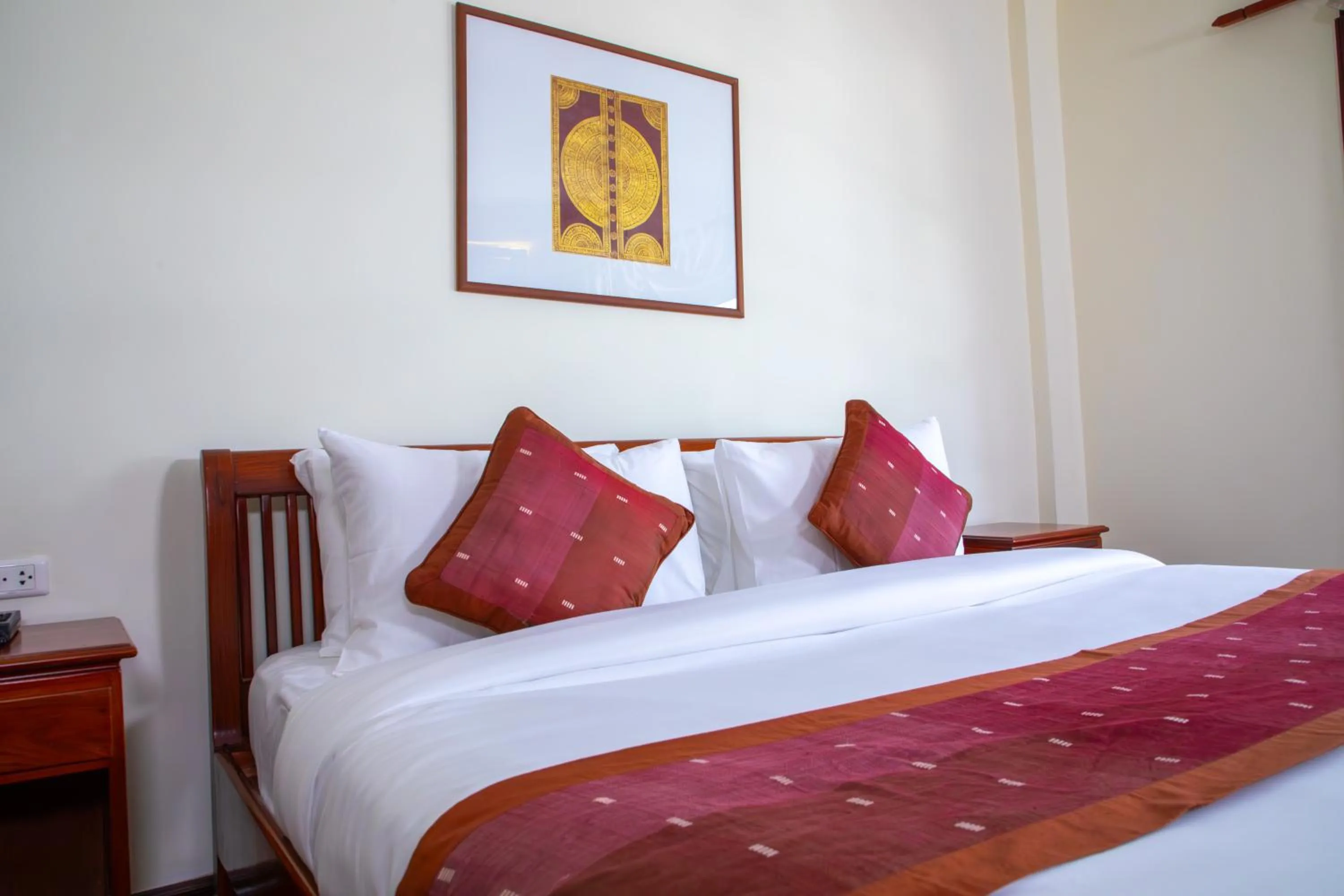 Bed in Phongsavath Boutique Hotel