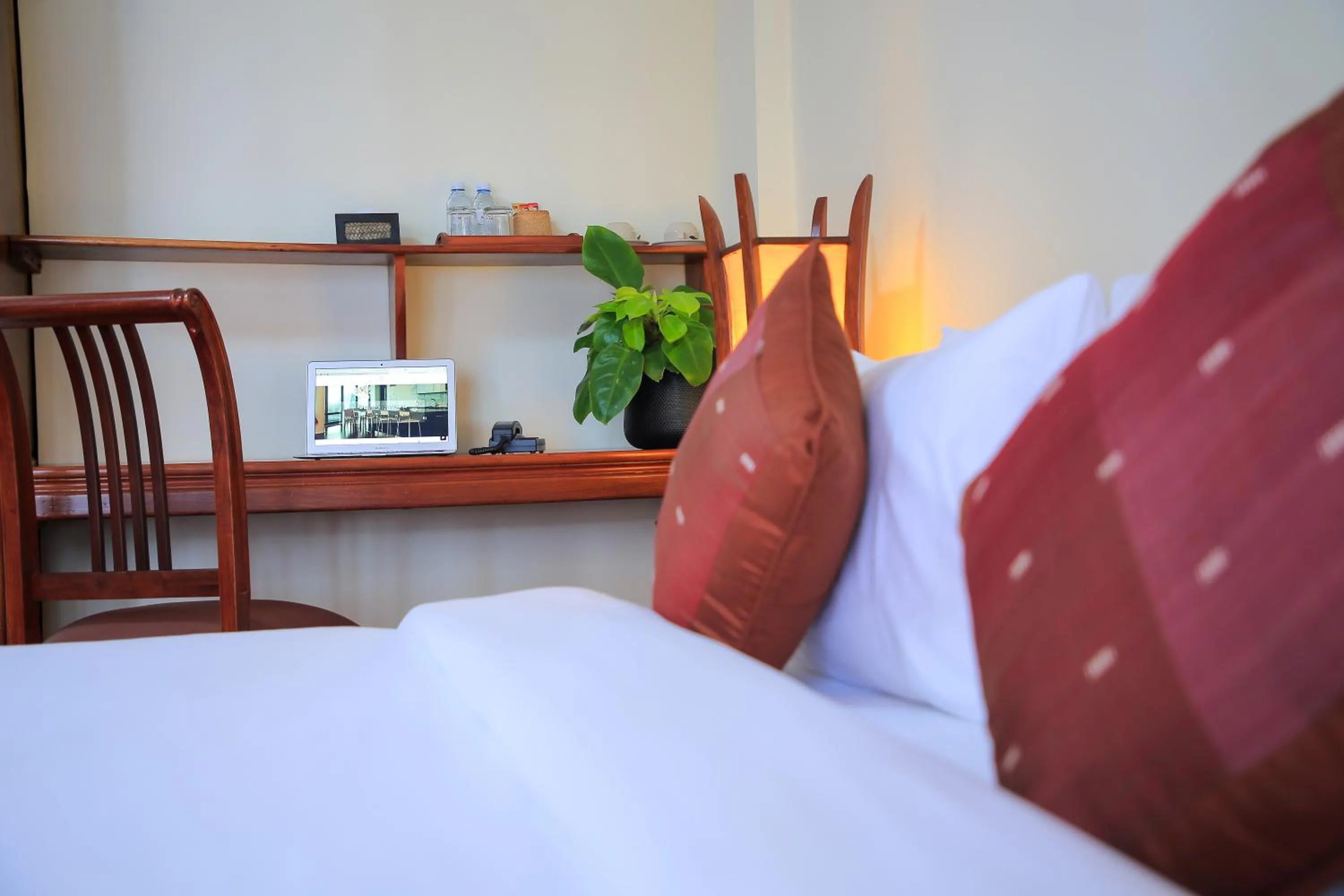 Bed in Phongsavath Boutique Hotel