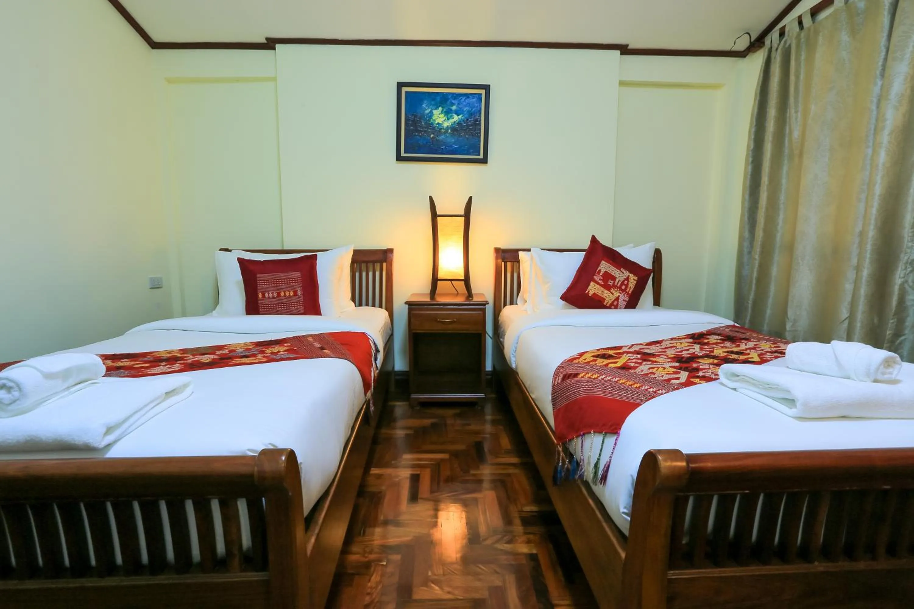 Bed in Phongsavath Boutique Hotel