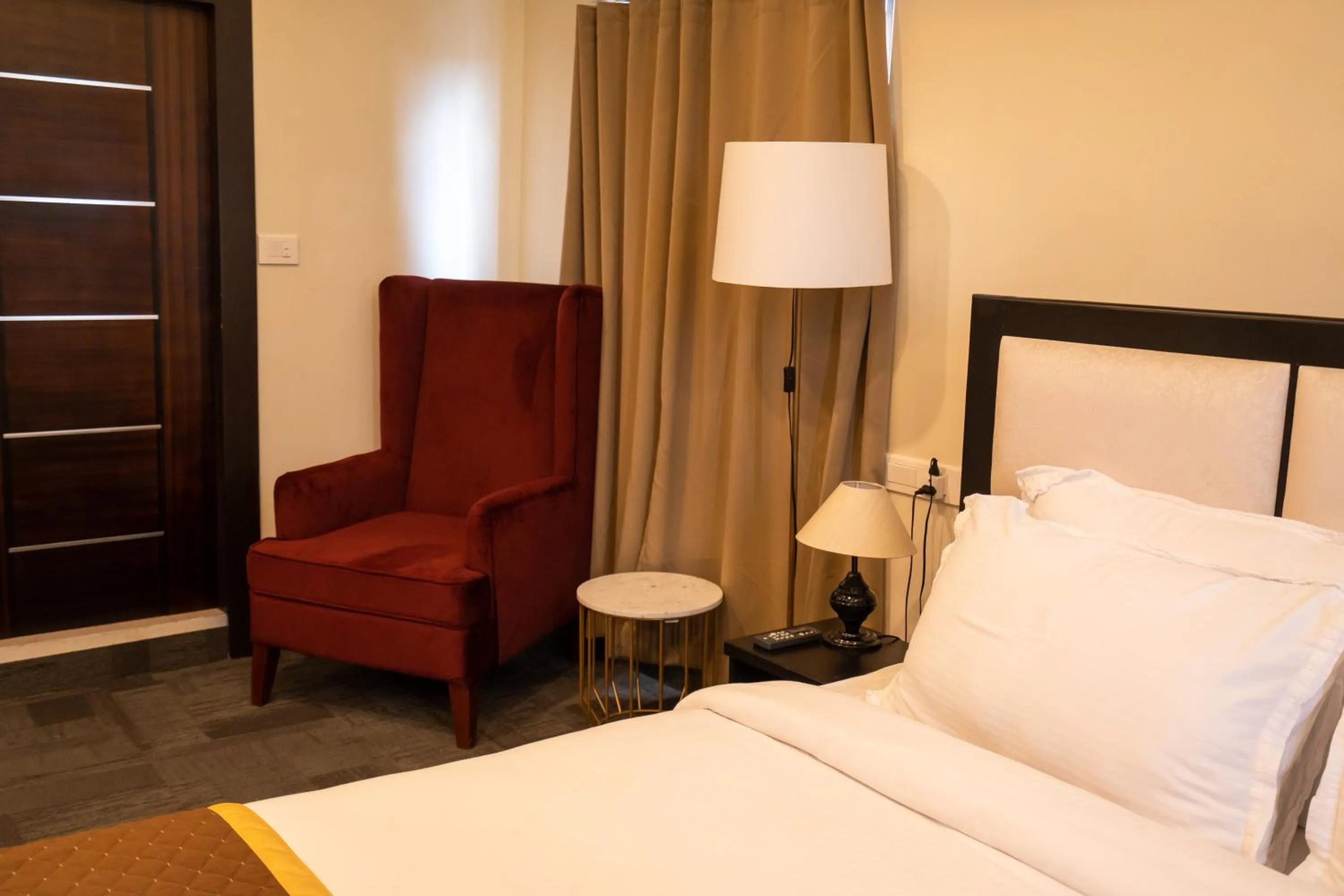 Bed in ROYALE LALAWI HOTEL