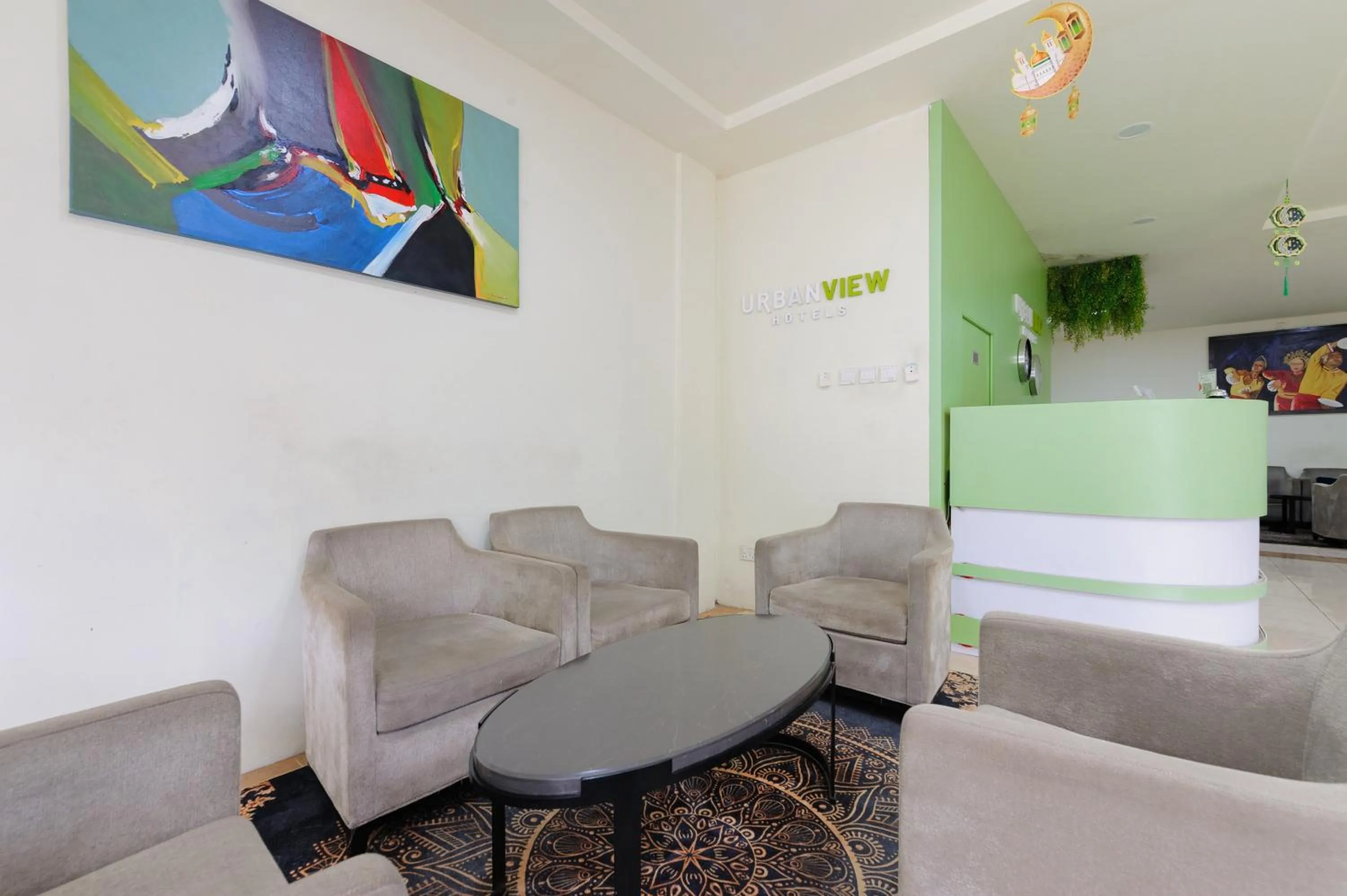 Seating area in Urbanview Hotel Kansa near Harbour Bay Batam by RedDoorz