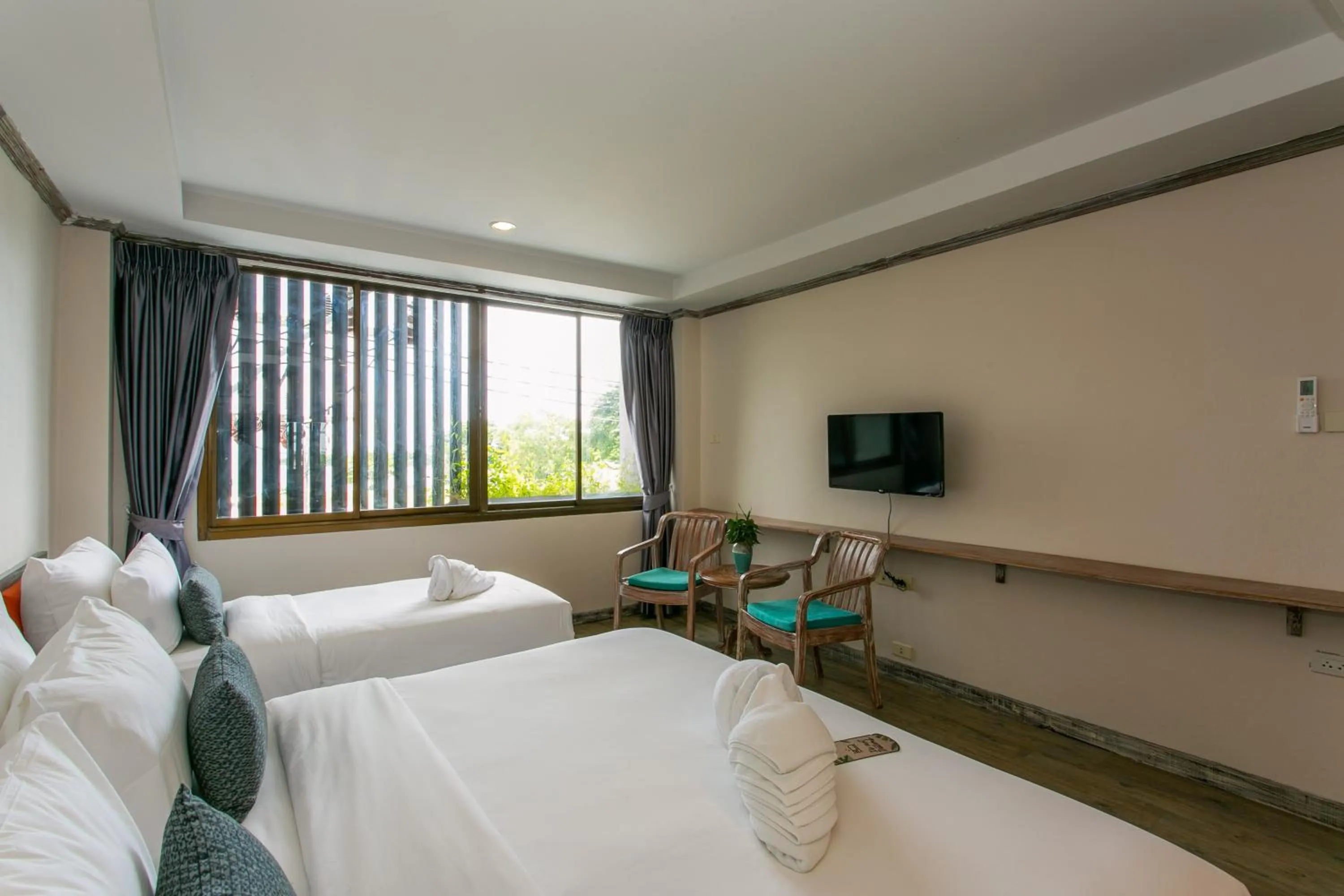 Bed in JALMIN Hotel Samui