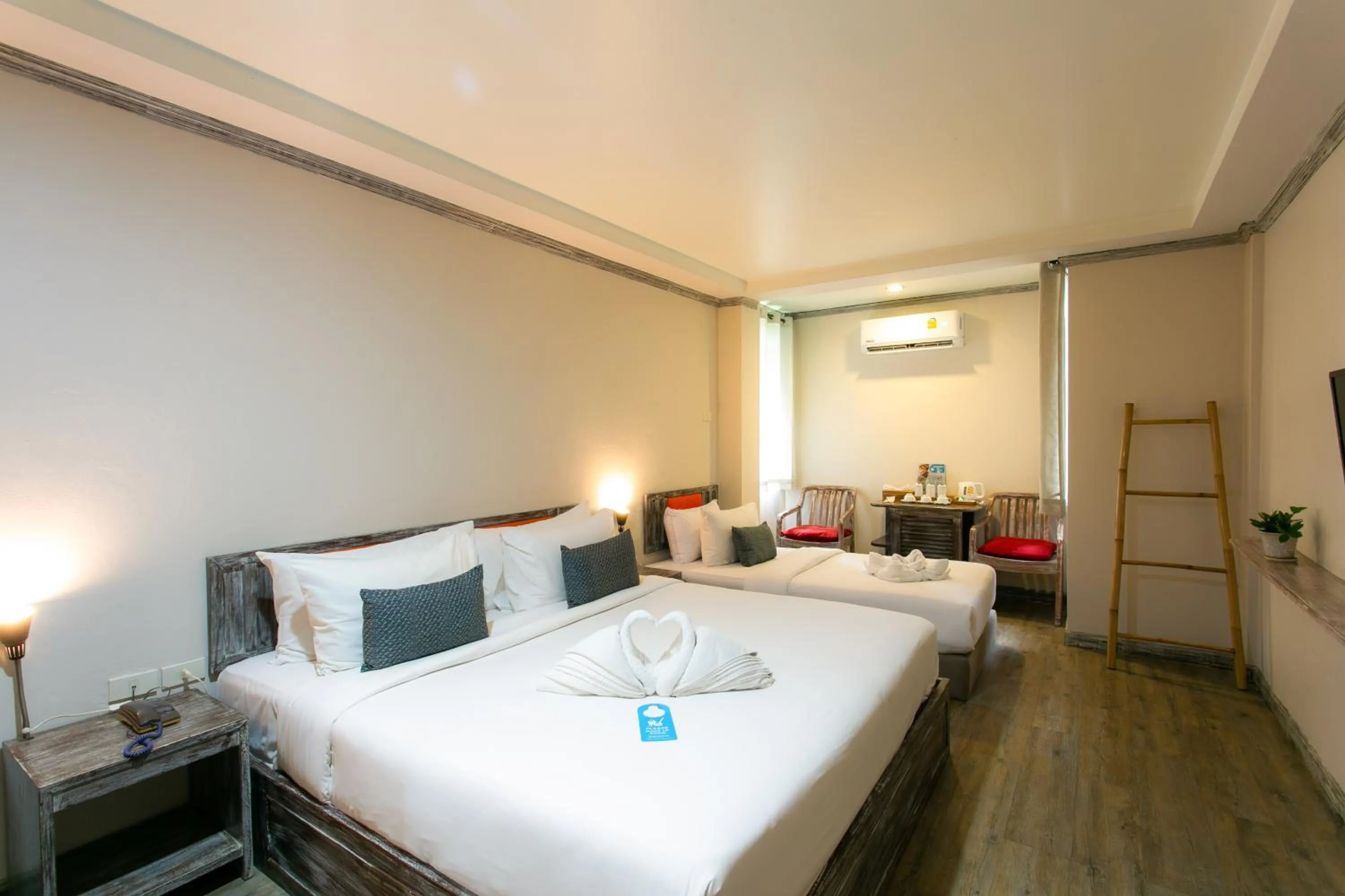 Bed in JALMIN Hotel Samui