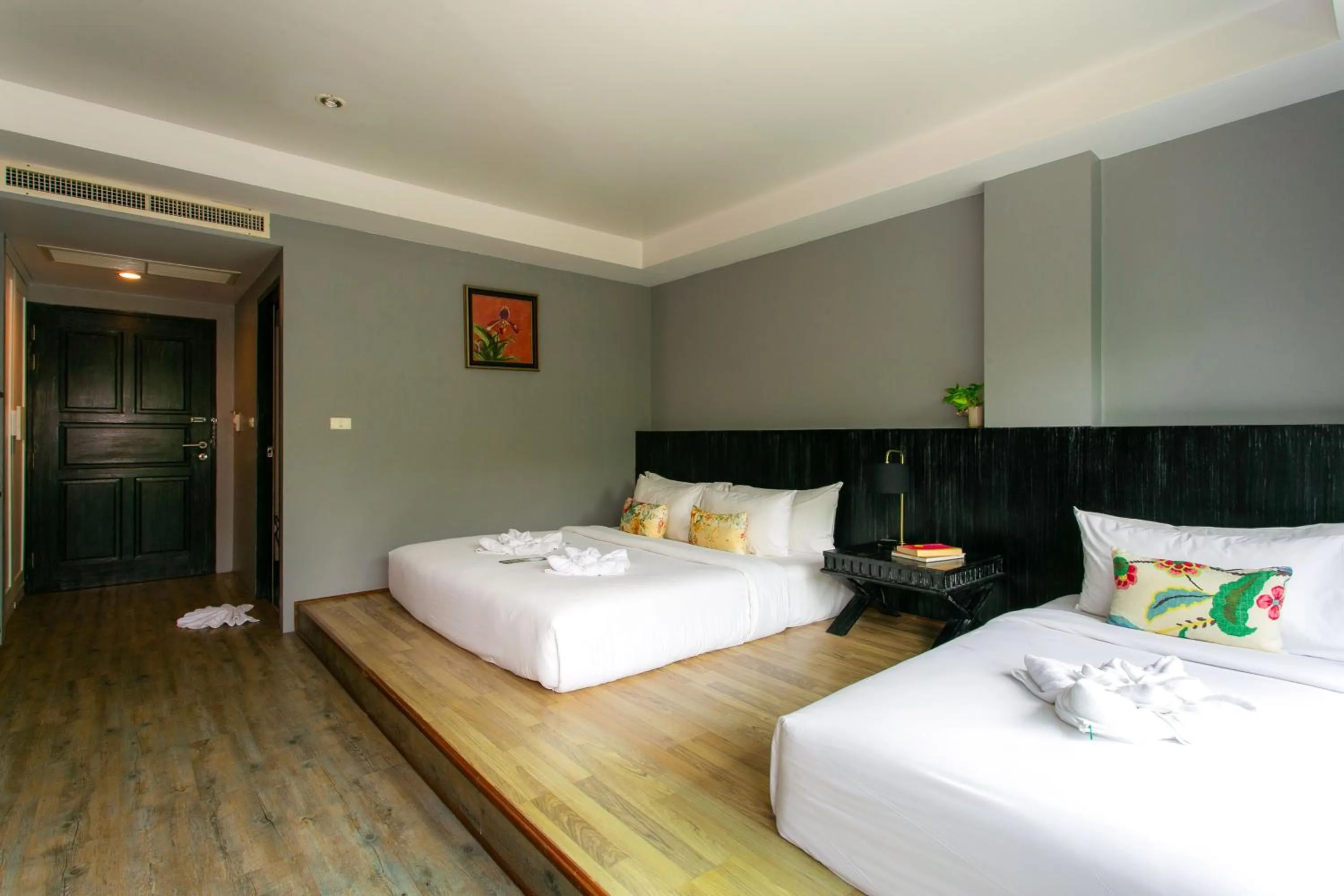 Bed in JALMIN Hotel Samui