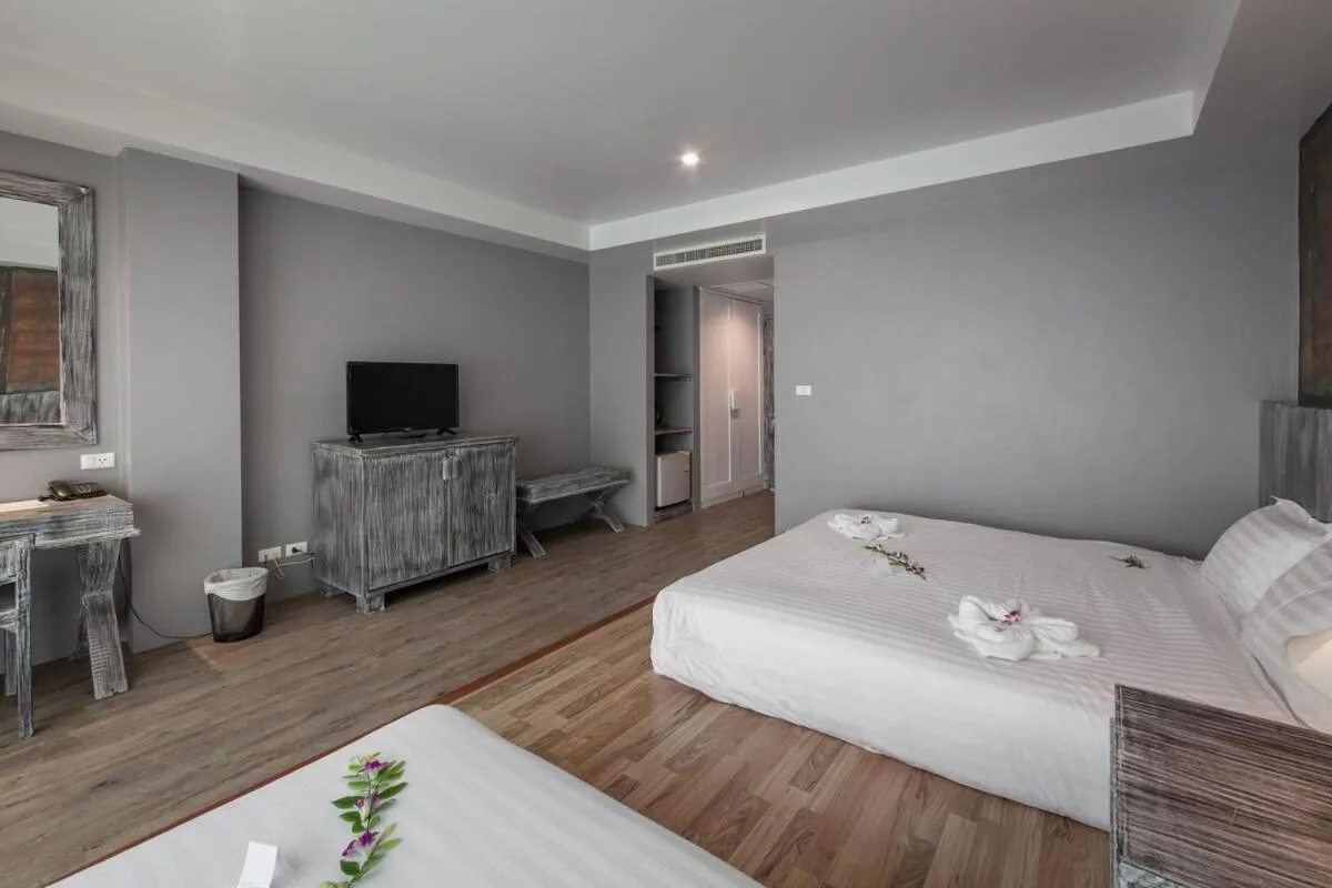 Bed in JALMIN Hotel Samui