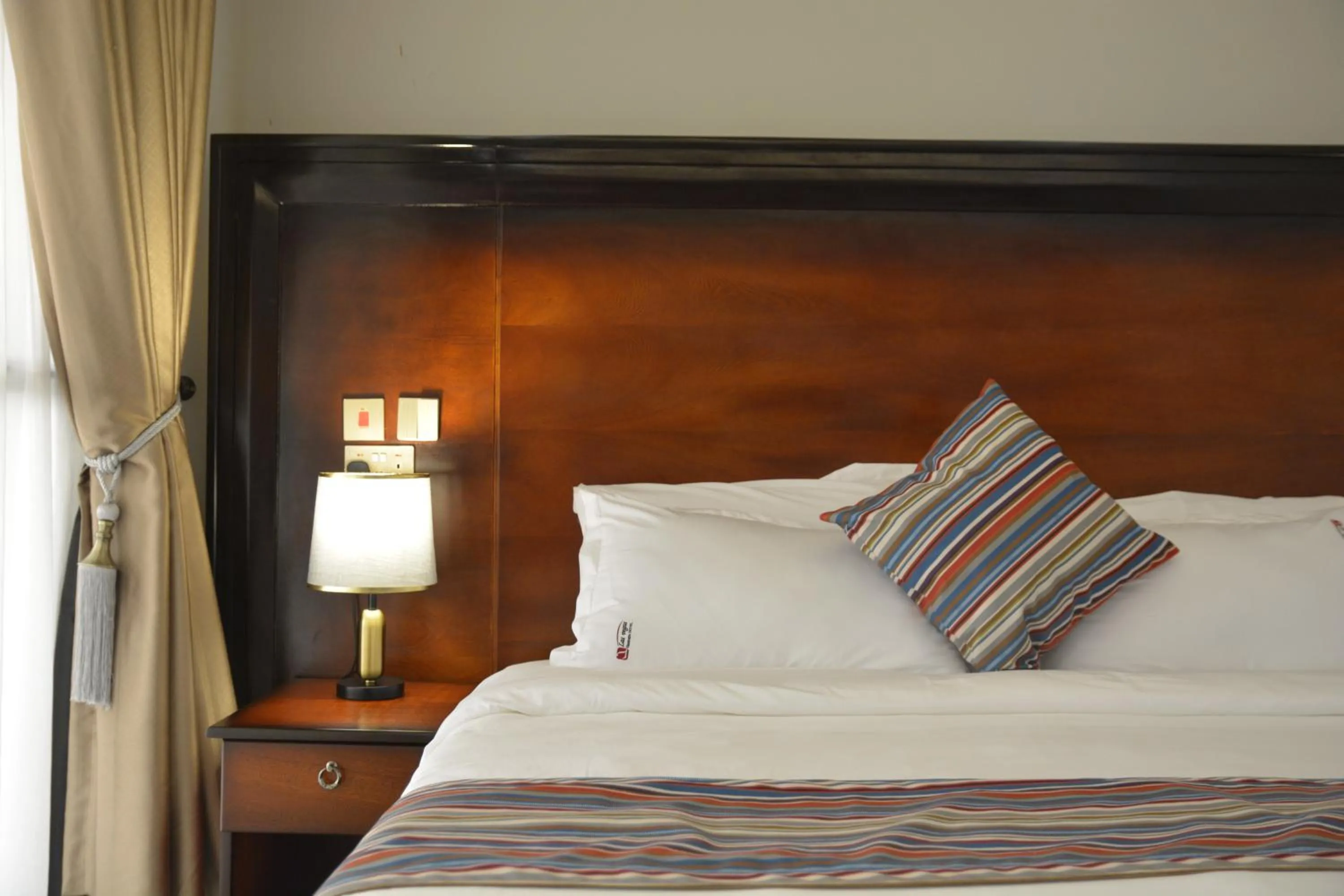 Bed in Las Vegas Garden Hotel Mbarara