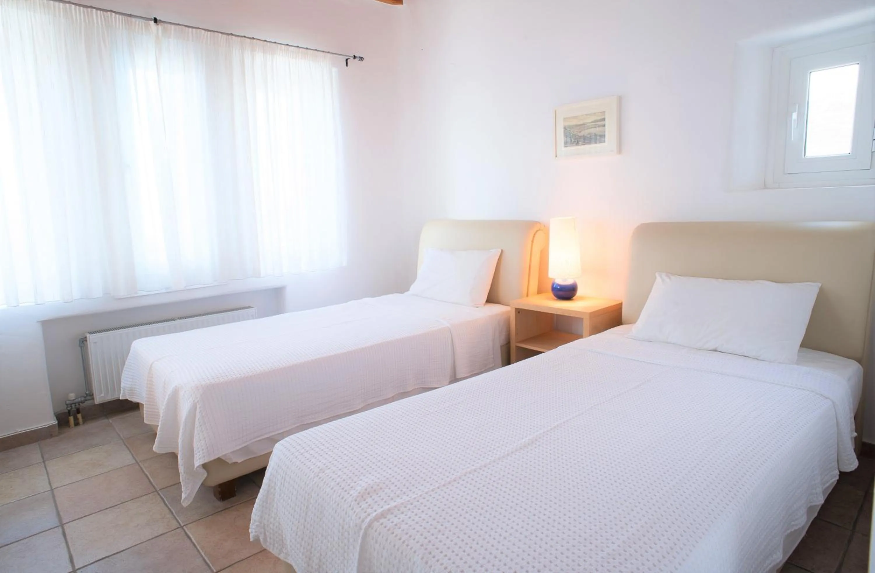 Bed in Aeri Villas & Apartments