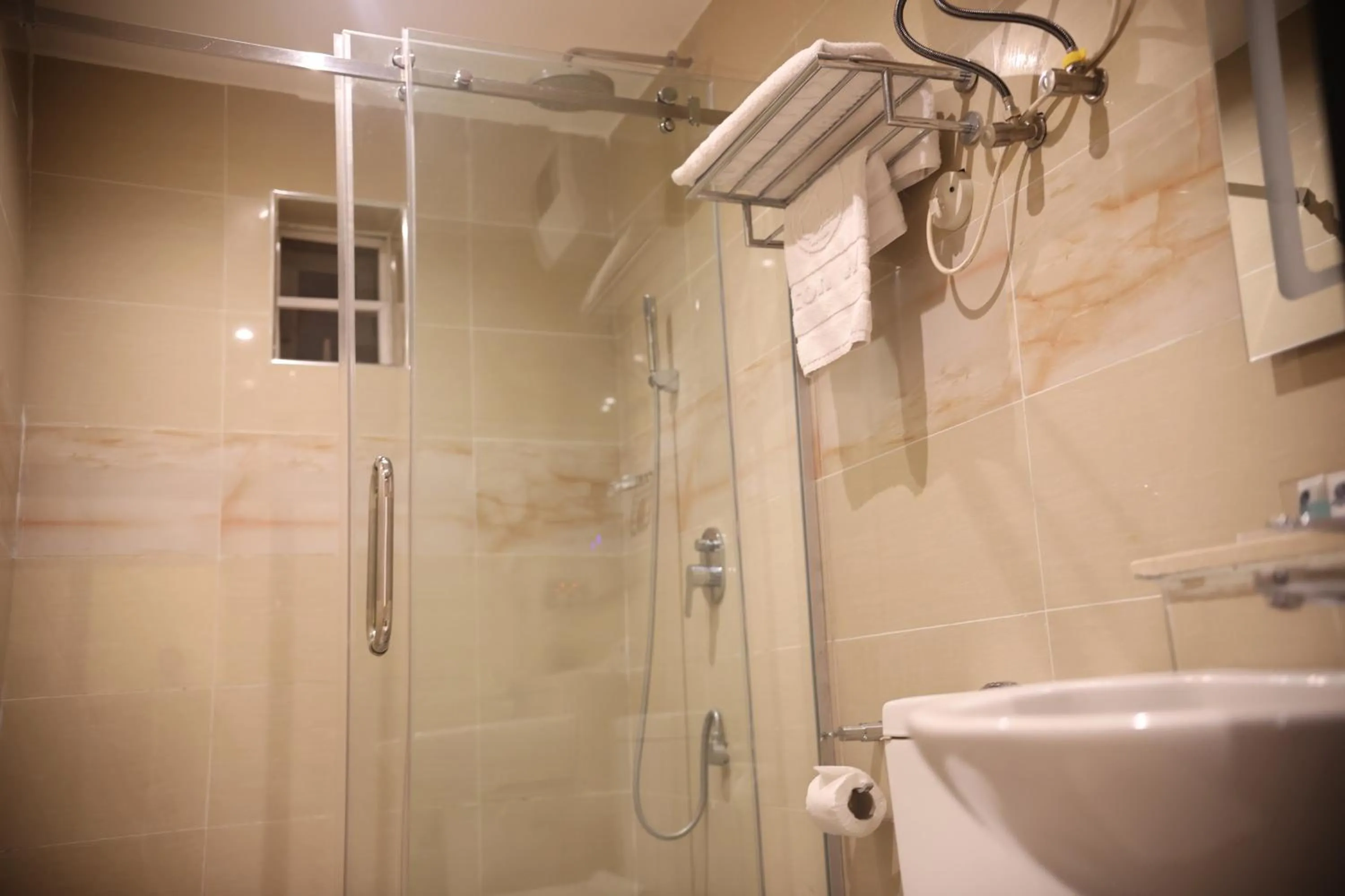 Shower in Bolton White Hotel - Abuja