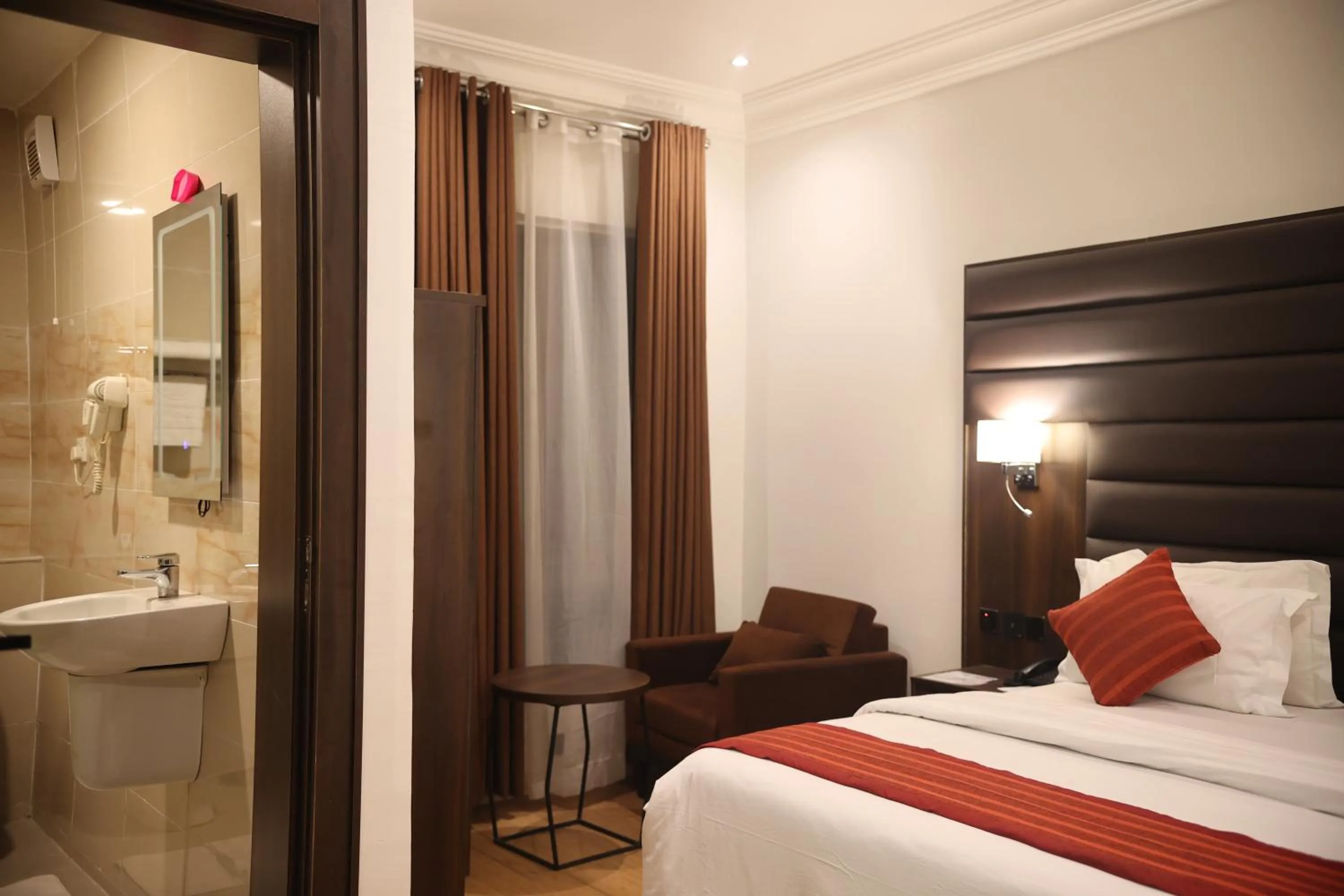 Shower in Bolton White Hotel - Abuja