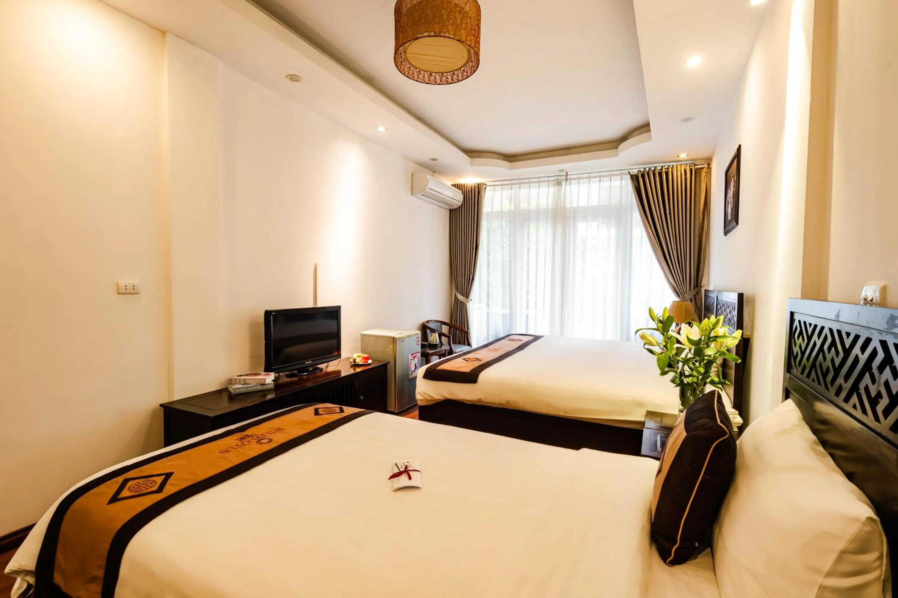 Bed in Wild Lotus Hotel & Travel 2